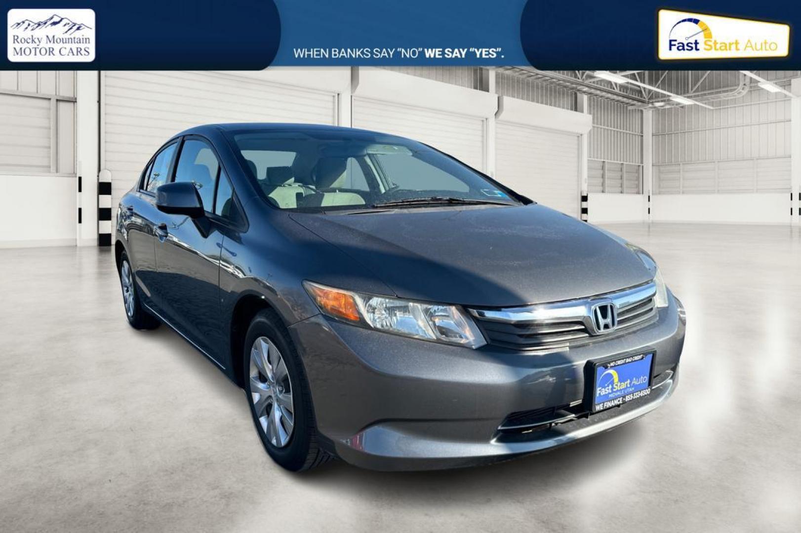 2012 Gray Honda Civic LX Sedan 5-Speed MT (2HGFB2E59CH) with an 1.8L L4 SOHC 16V engine, 5-Speed Manual transmission, located at 344 S Washington Blvd, Ogden, UT, 84404, (801) 399-1799, 41.255482, -111.970848 - Photo#0