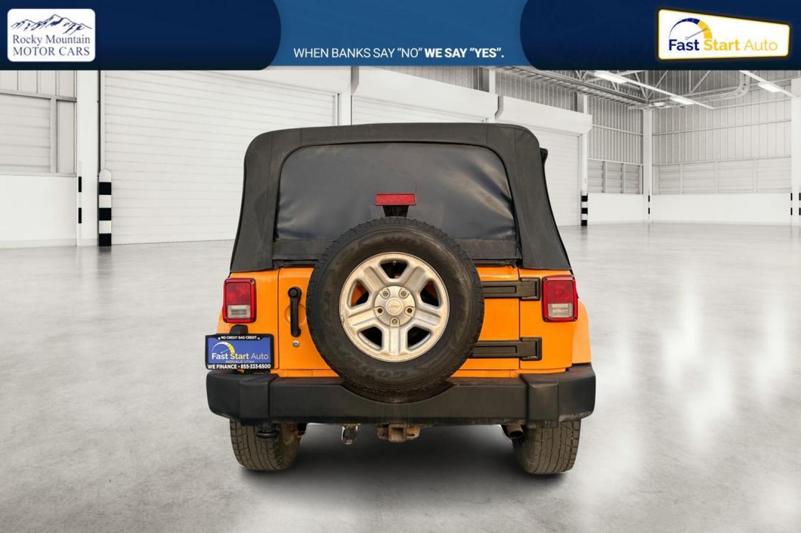 2012 Yellow Jeep Wrangler Unlimited Sahara 4WD (1C4BJWEG3CL) with an 3.6L V6 DOHC 24V FFV engine, Automatic, 5-Spd transmission, located at 7755 State Street, Midvale, UT, 84047, (801) 753-9063, 40.610329, -111.890656 - Photo#4