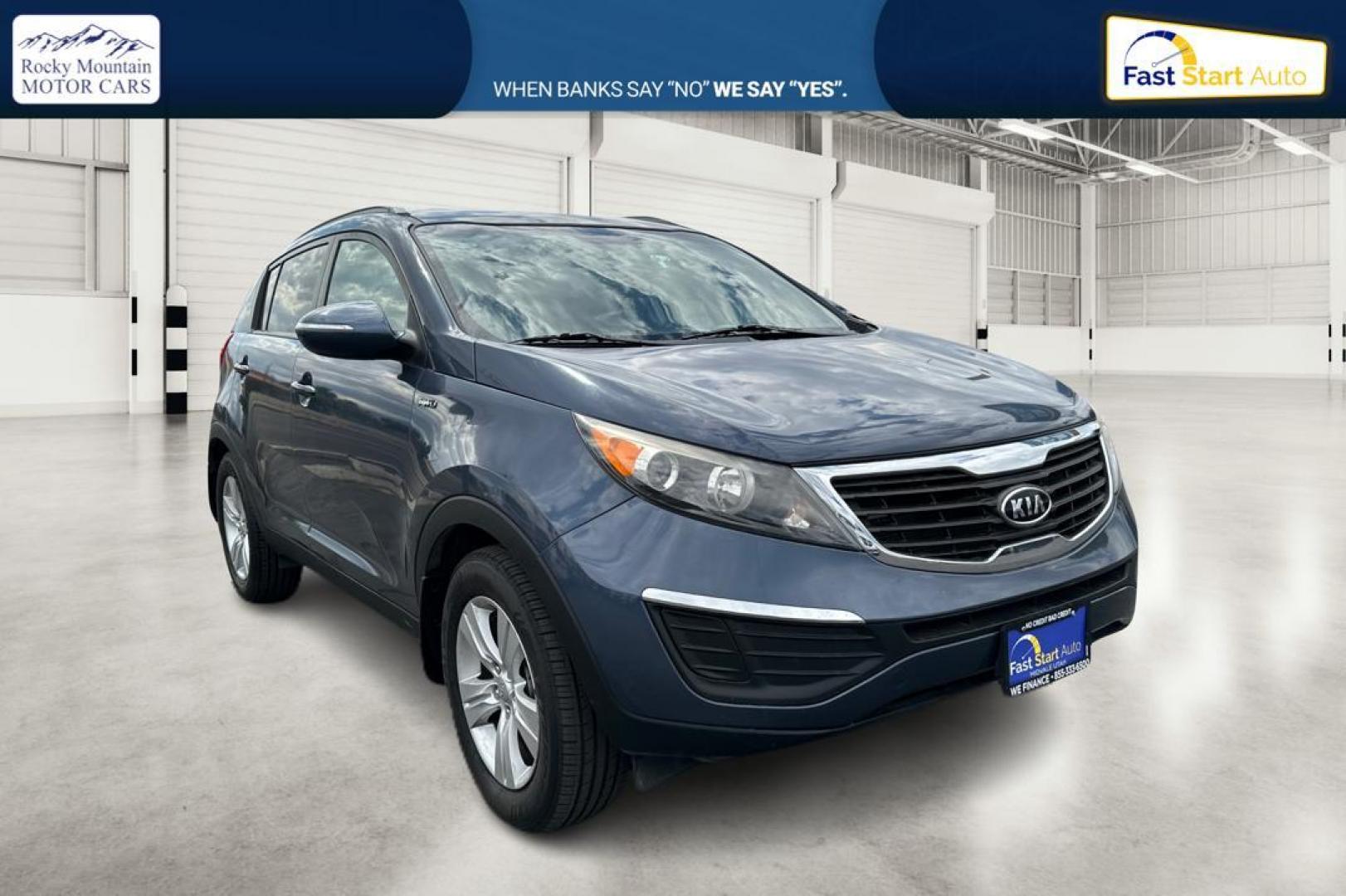 2012 Blue Kia Sportage LX AWD (KNDPBCA22C7) with an 2.4L V6 DOHC 24V engine, 6-Speed Automatic transmission, located at 344 S Washington Blvd, Ogden, UT, 84404, (801) 399-1799, 41.255482, -111.970848 - Photo#0