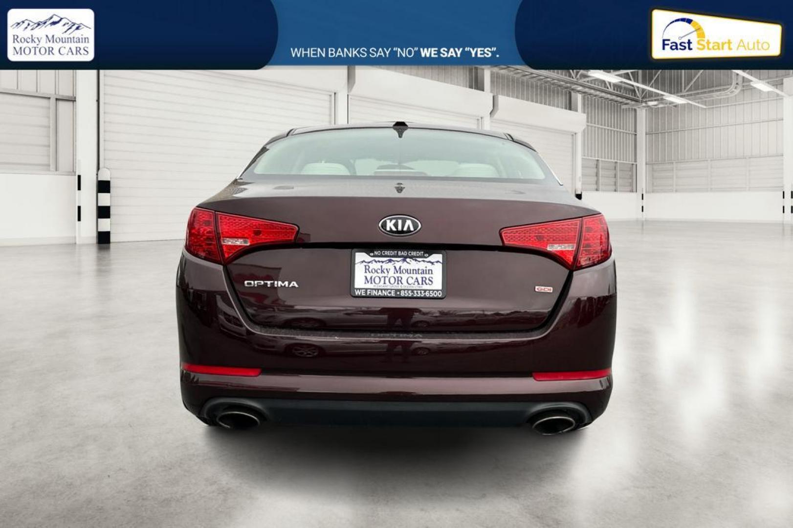 2013 Purple Kia Optima LX MT (5XXGM4A75DG) with an 2.4L L4 DOHC 16V engine, 5-Speed Manual transmission, located at 767 S State Road, Pleasant Grove, UT, 84062, (801) 785-1058, 40.354839, -111.736687 - Photo#4