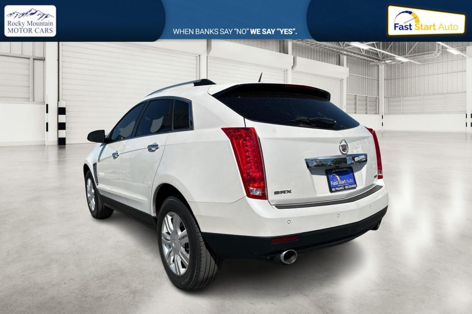 2014 White Cadillac SRX Luxury Collection FWD (3GYFNBE31ES) with an 3.6L V6 DOHC 24V FFV engine, 6-Speed Automatic transmission, located at 344 S Washington Blvd, Ogden, UT, 84404, (801) 399-1799, 41.255482, -111.970848 - Photo#4