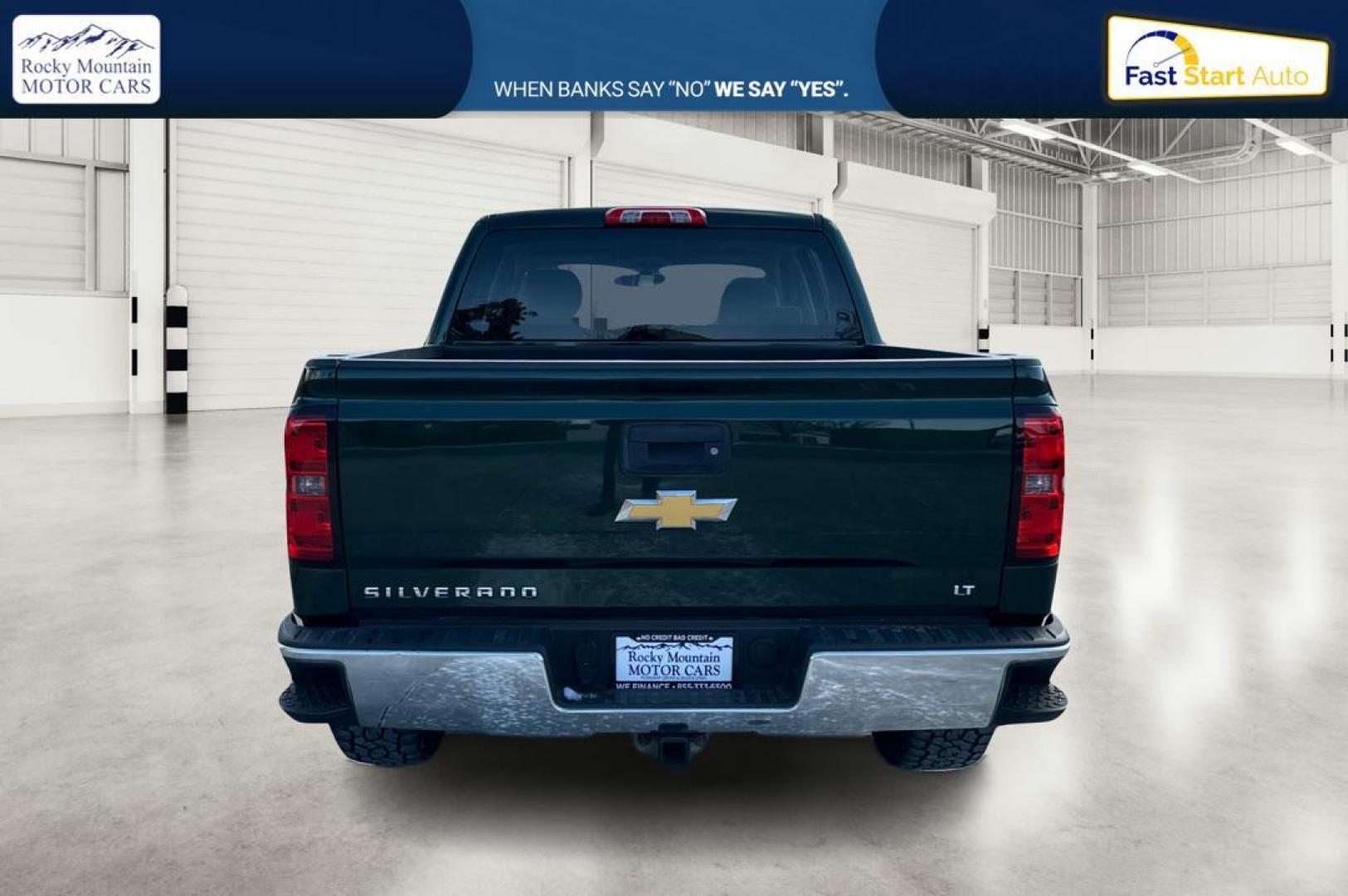 2014 Green Chevrolet Silverado 1500 1LT Crew Cab 4WD (3GCUKREC0EG) with an 5.3L V8 OHV 16V engine, 6-Speed Automatic transmission, located at 767 S State Road, Pleasant Grove, UT, 84062, (801) 785-1058, 40.354839, -111.736687 - Photo#4