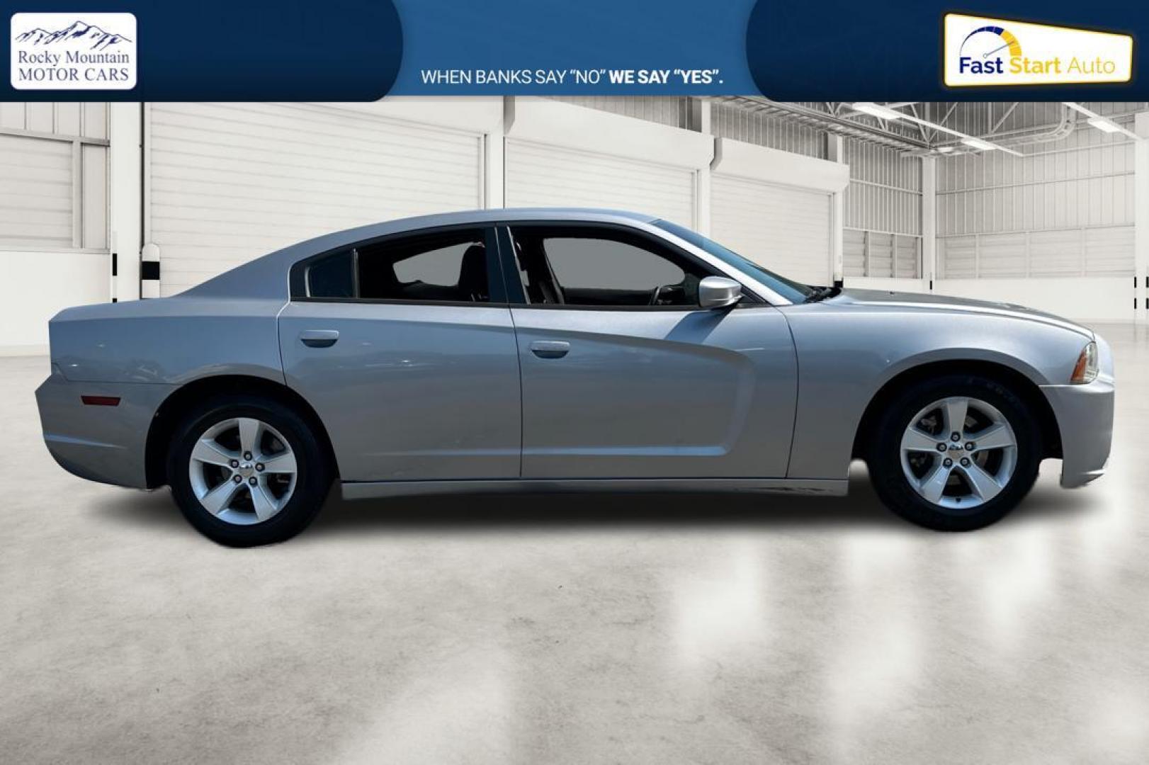 2014 Silver Dodge Charger SE (2C3CDXBG9EH) with an 3.6L V6 DOHC 24V engine, 5-Speed Automatic transmission, located at 767 S State Road, Pleasant Grove, UT, 84062, (801) 785-1058, 40.354839, -111.736687 - Photo#1