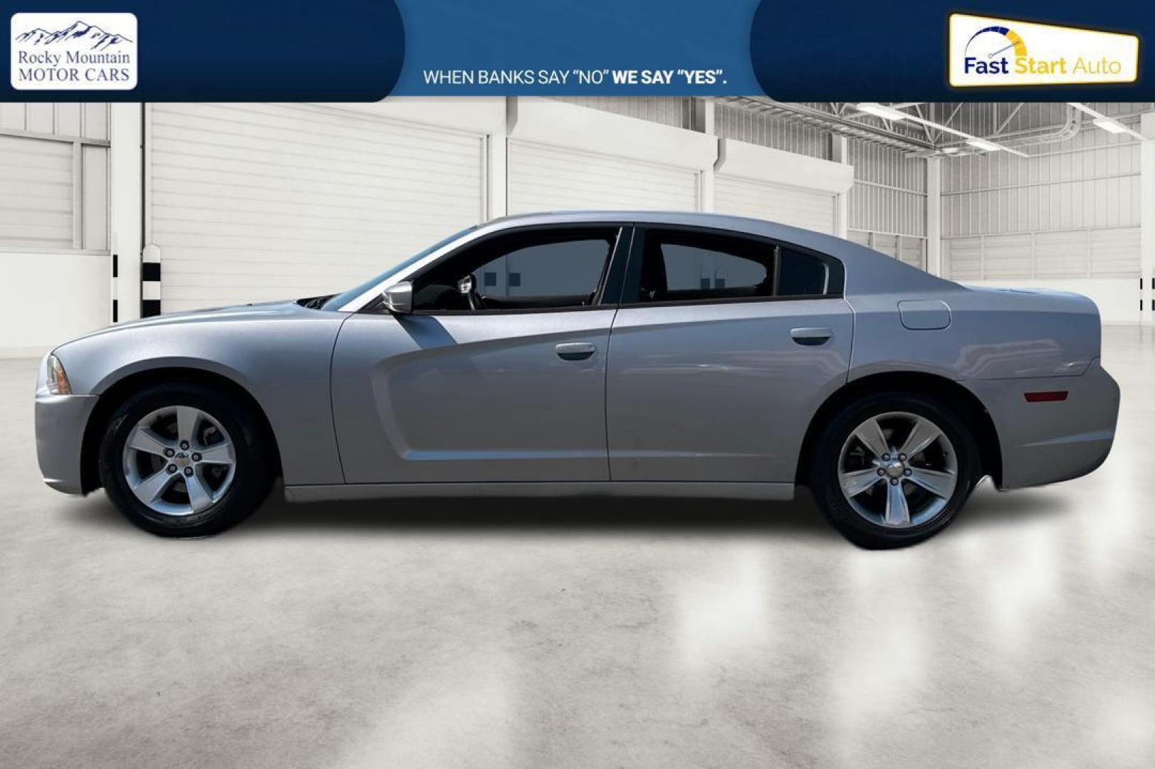 2014 Silver Dodge Charger SE (2C3CDXBG9EH) with an 3.6L V6 DOHC 24V engine, 5-Speed Automatic transmission, located at 767 S State Road, Pleasant Grove, UT, 84062, (801) 785-1058, 40.354839, -111.736687 - Photo#5