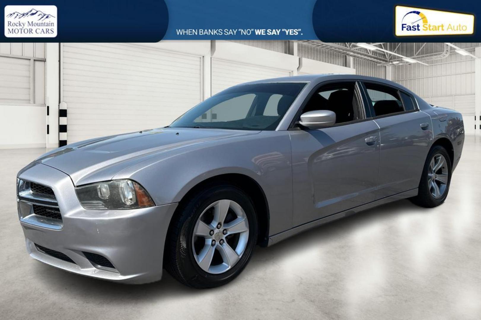 2014 Silver Dodge Charger SE (2C3CDXBG9EH) with an 3.6L V6 DOHC 24V engine, 5-Speed Automatic transmission, located at 767 S State Road, Pleasant Grove, UT, 84062, (801) 785-1058, 40.354839, -111.736687 - Photo#6