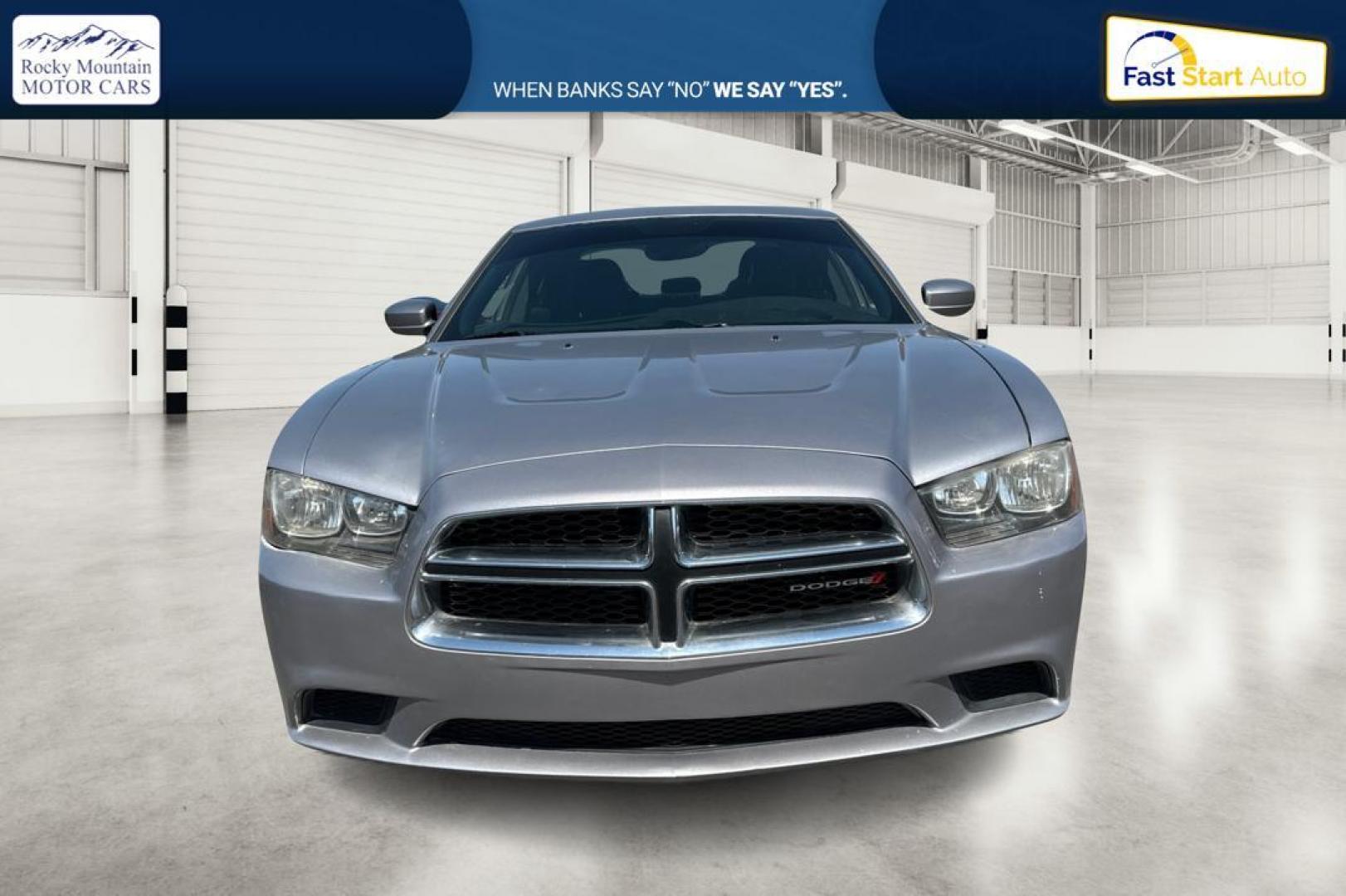 2014 Silver Dodge Charger SE (2C3CDXBG9EH) with an 3.6L V6 DOHC 24V engine, 5-Speed Automatic transmission, located at 767 S State Road, Pleasant Grove, UT, 84062, (801) 785-1058, 40.354839, -111.736687 - Photo#7