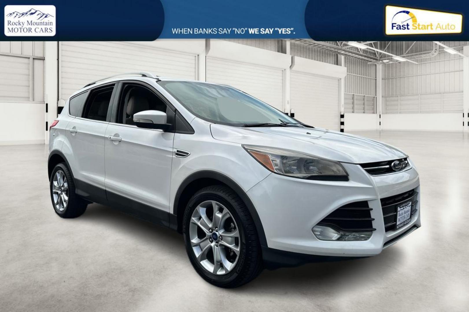 2014 White Ford Escape Titanium FWD (1FMCU0JX5EU) with an 1.6L L4 DOHC 16V engine, 6-Speed Automatic transmission, located at 767 S State Road, Pleasant Grove, UT, 84062, (801) 785-1058, 40.354839, -111.736687 - Photo#0