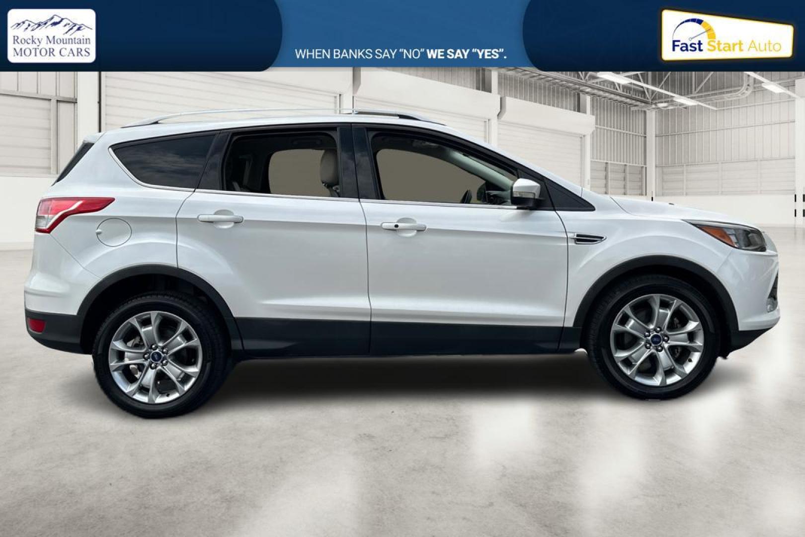 2014 White Ford Escape Titanium FWD (1FMCU0JX5EU) with an 1.6L L4 DOHC 16V engine, 6-Speed Automatic transmission, located at 767 S State Road, Pleasant Grove, UT, 84062, (801) 785-1058, 40.354839, -111.736687 - Photo#1