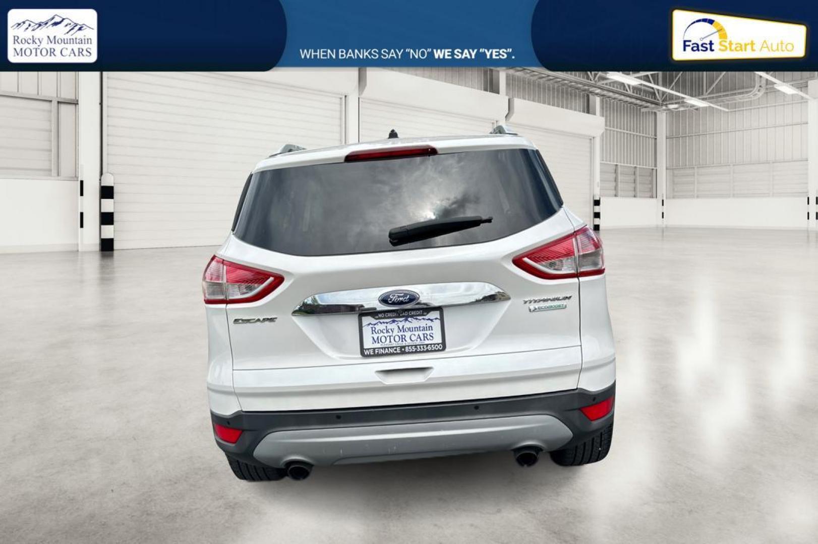 2014 White Ford Escape Titanium FWD (1FMCU0JX5EU) with an 1.6L L4 DOHC 16V engine, 6-Speed Automatic transmission, located at 767 S State Road, Pleasant Grove, UT, 84062, (801) 785-1058, 40.354839, -111.736687 - Photo#3