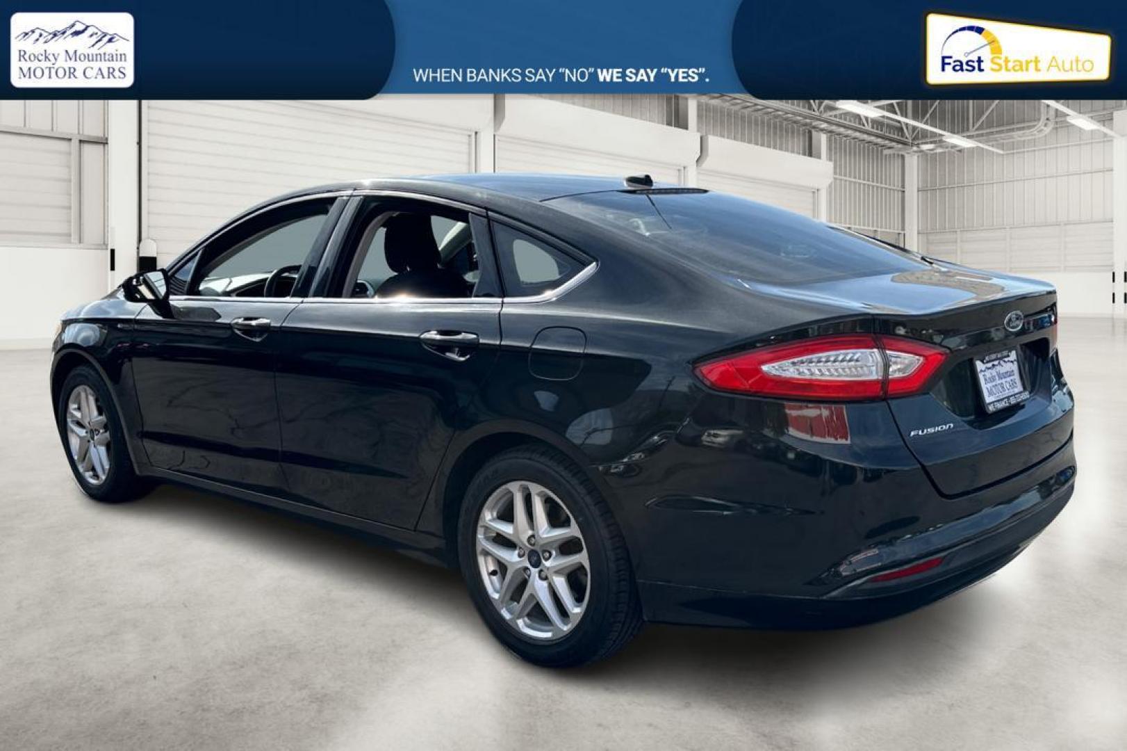 2014 Black Ford Fusion SE (3FA6P0HD1ER) with an 1.5L L4 DOHC 16V engine, Automatic, 6-Spd transmission, located at 767 S State Road, Pleasant Grove, UT, 84062, (801) 785-1058, 40.354839, -111.736687 - Photo#5