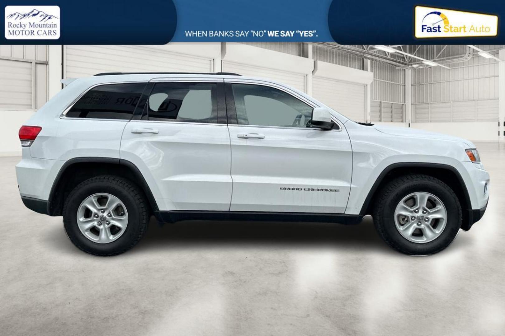 2014 White Jeep Grand Cherokee Laredo 4WD (1C4RJFAG2EC) with an 3.6L V6 DOHC 24V engine, 5-Speed Automatic transmission, located at 7755 State Street, Midvale, UT, 84047, (801) 753-9063, 40.610329, -111.890656 - Photo#1