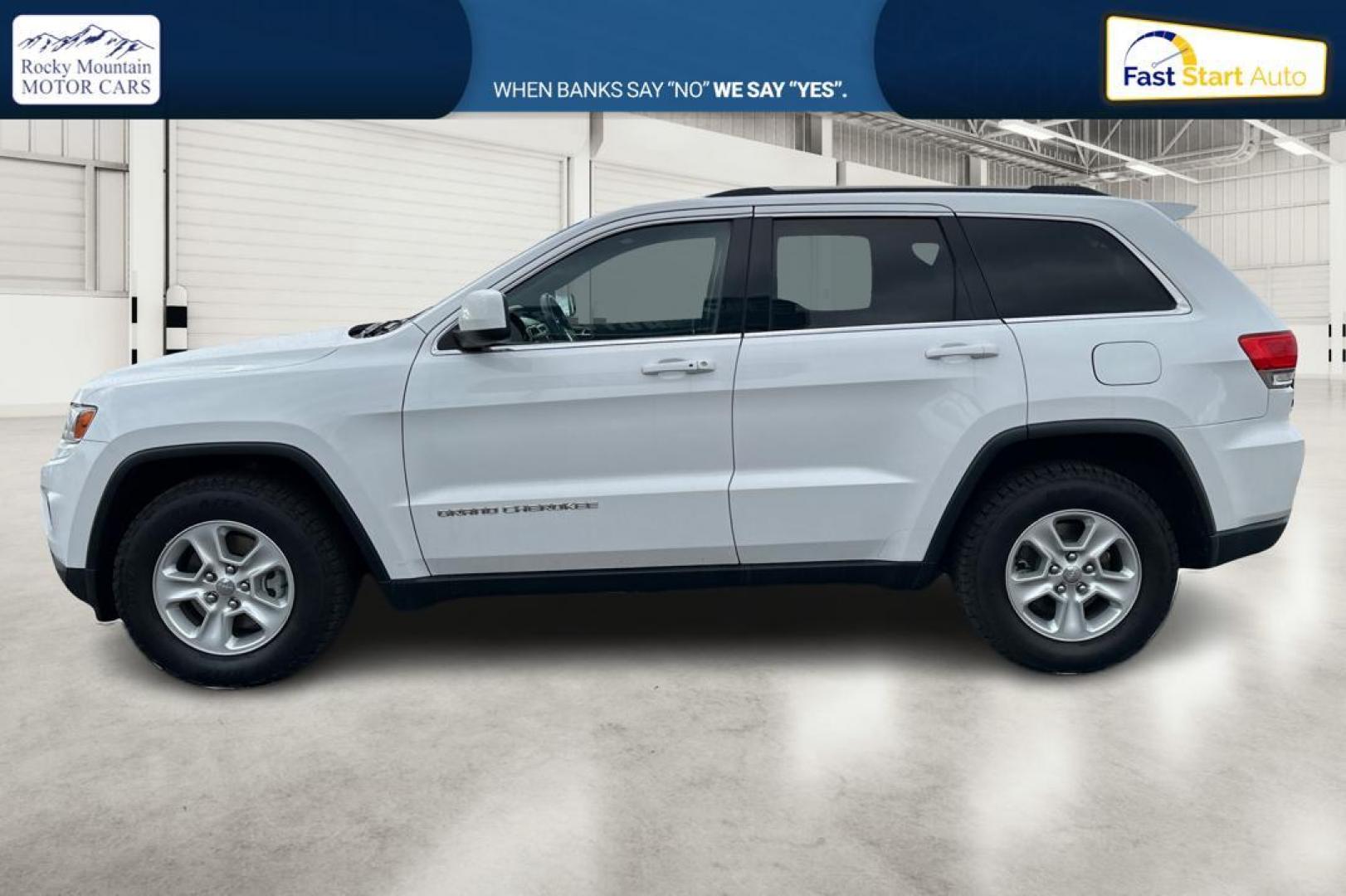 2014 White Jeep Grand Cherokee Laredo 4WD (1C4RJFAG2EC) with an 3.6L V6 DOHC 24V engine, 5-Speed Automatic transmission, located at 7755 State Street, Midvale, UT, 84047, (801) 753-9063, 40.610329, -111.890656 - Photo#6