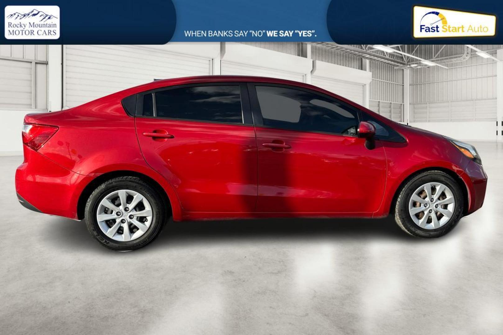 2014 Red Kia Rio LX (KNADM4A35E6) with an 1.6L L4 DOHC 16V engine, Automatic, 6-Spd transmission, located at 767 S State Road, Pleasant Grove, UT, 84062, (801) 785-1058, 40.354839, -111.736687 - Photo#1