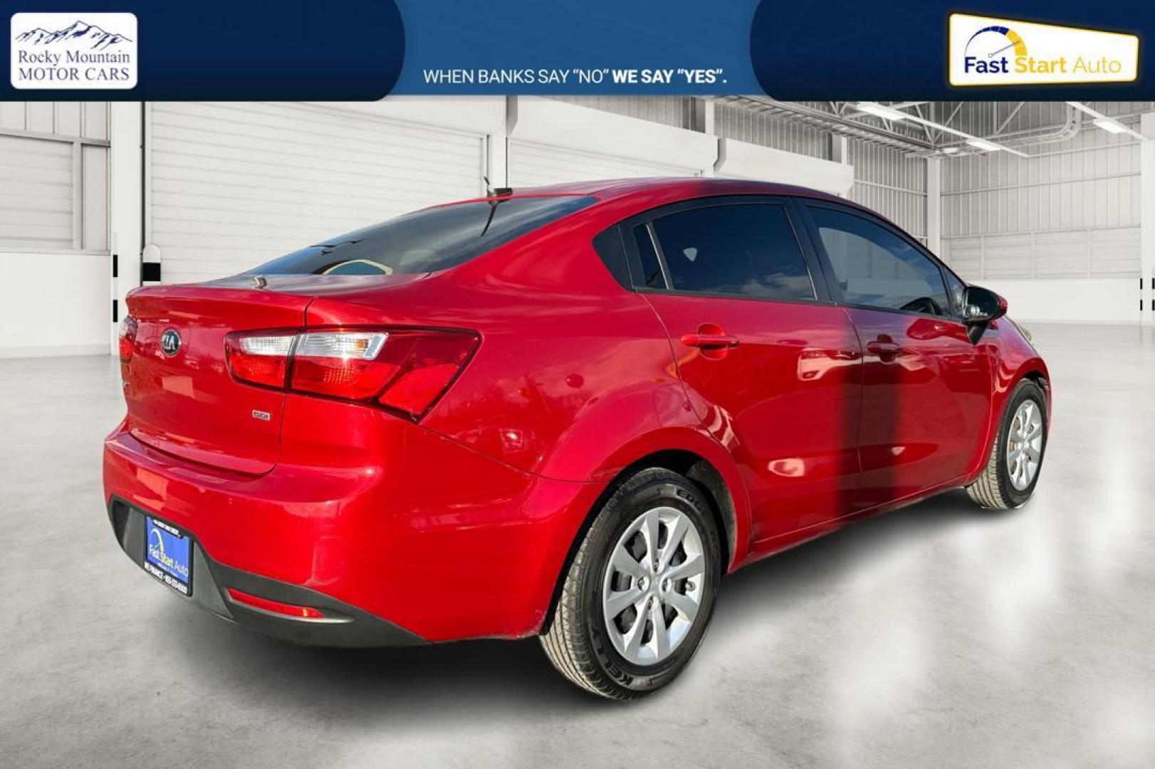 2014 Red Kia Rio LX (KNADM4A35E6) with an 1.6L L4 DOHC 16V engine, Automatic, 6-Spd transmission, located at 767 S State Road, Pleasant Grove, UT, 84062, (801) 785-1058, 40.354839, -111.736687 - Photo#2