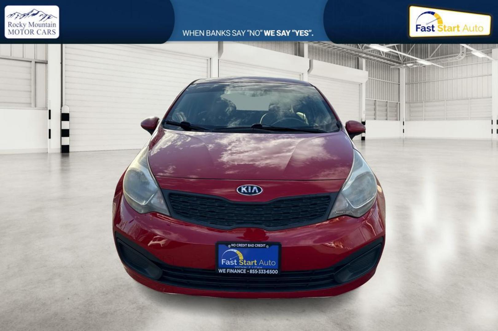 2014 Red Kia Rio LX (KNADM4A35E6) with an 1.6L L4 DOHC 16V engine, Automatic, 6-Spd transmission, located at 767 S State Road, Pleasant Grove, UT, 84062, (801) 785-1058, 40.354839, -111.736687 - Photo#9