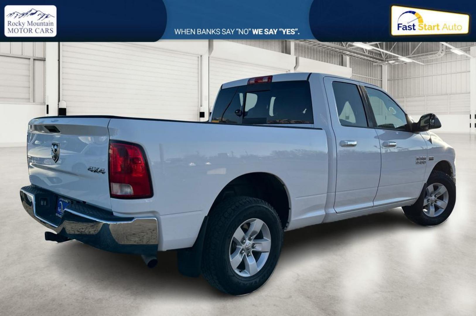 2014 White RAM 1500 SLT Quad Cab 4WD (1C6RR7GT3ES) with an 5.7L V8 OHV 16V engine, 6-Speed Automatic transmission, located at 767 S State Road, Pleasant Grove, UT, 84062, (801) 785-1058, 40.354839, -111.736687 - Photo#2