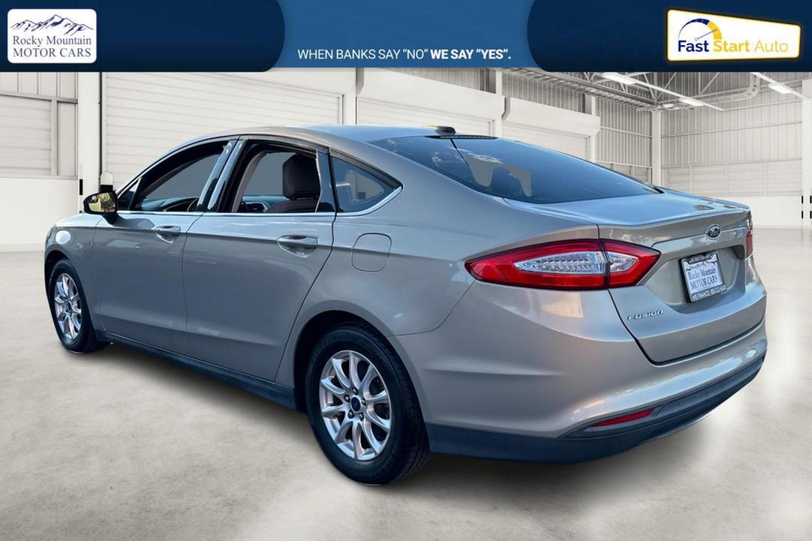 2015 Gray Ford Fusion S (3FA6P0G77FR) with an 2.5L L4 DOHC 16V engine, Auto, 6-Spd w/SelShft transmission, located at 344 S Washington Blvd, Ogden, UT, 84404, (801) 399-1799, 41.255482, -111.970848 - Photo#5