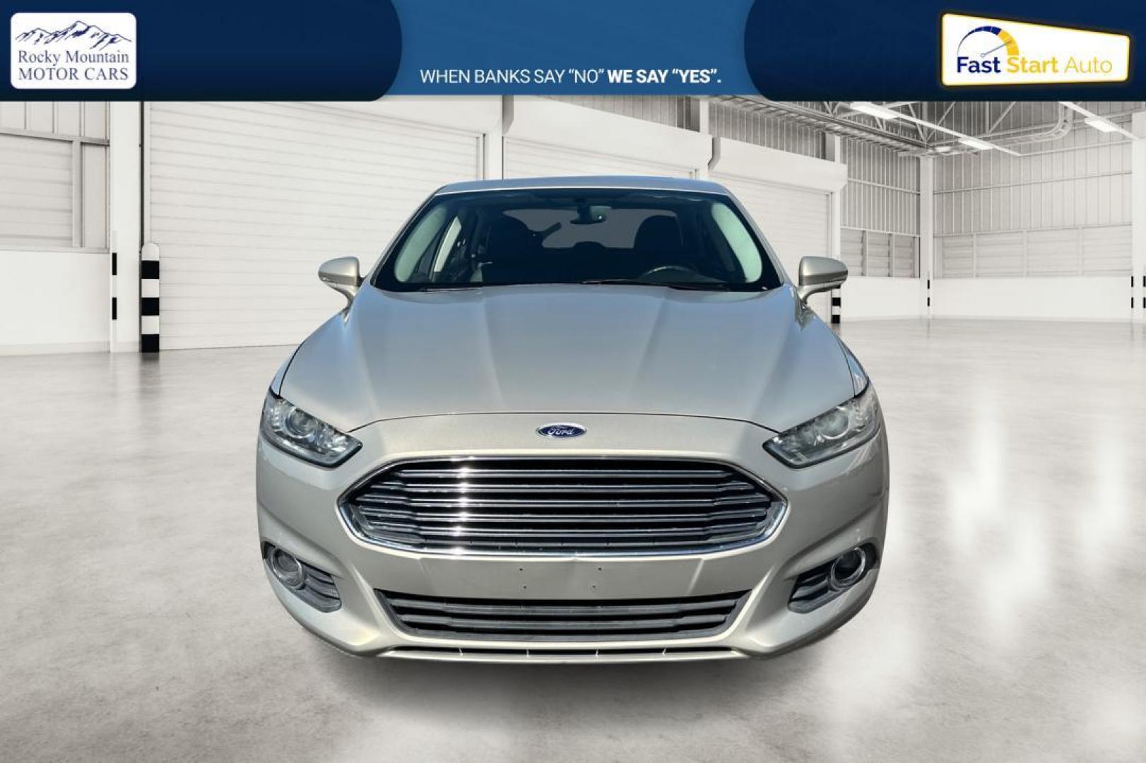 2015 Gray Ford Fusion SE (3FA6P0HDXFR) with an 1.5L L4 DOHC 16V engine, Auto, 6-Spd w/SelShft transmission, located at 344 S Washington Blvd, Ogden, UT, 84404, (801) 399-1799, 41.255482, -111.970848 - Photo#7