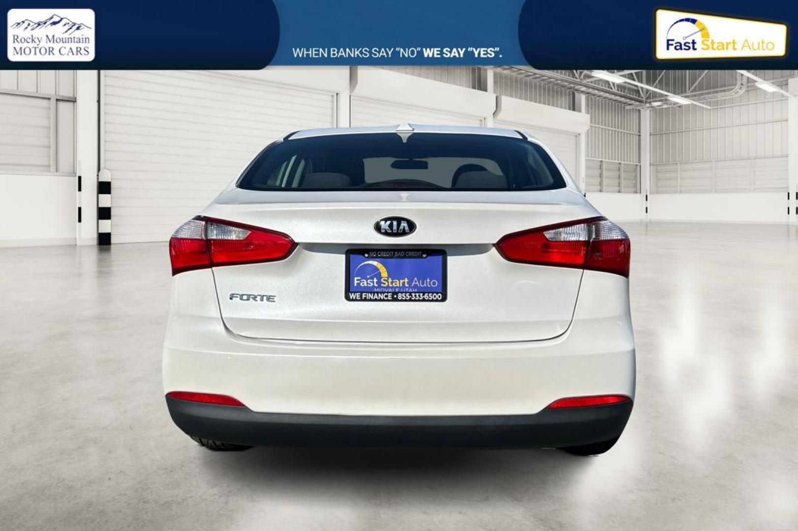 2015 White Kia Forte EX (KNAFX4A61F5) with an 1.8L L4 DOHC 16V engine, 6-Speed Automatic transmission, located at 344 S Washington Blvd, Ogden, UT, 84404, (801) 399-1799, 41.255482, -111.970848 - Photo#4