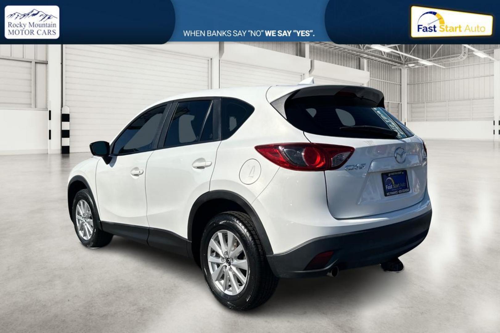 2015 White Mazda CX-5 Sport AT (JM3KE2BE4F0) with an 2.5L L4 DOHC 16V engine, 6-Speed Automatic transmission, located at 7755 State Street, Midvale, UT, 84047, (801) 753-9063, 40.610329, -111.890656 - Photo#5