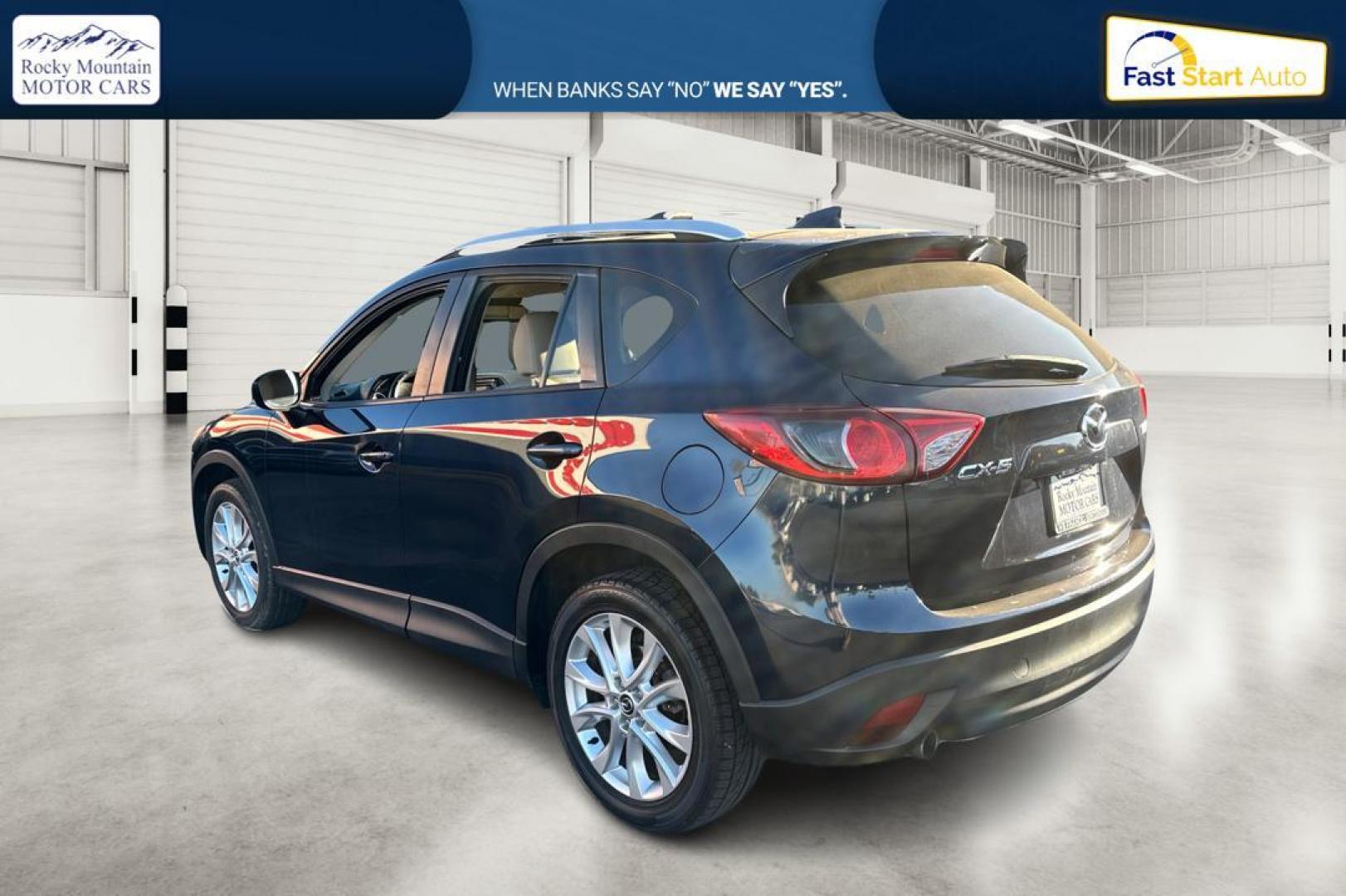 2015 Blue Mazda CX-5 Grand Touring (JM3KE2DY5F0) with an 2.5L L4 DOHC 16V engine, 6-Speed Automatic transmission, located at 344 S Washington Blvd, Ogden, UT, 84404, (801) 399-1799, 41.255482, -111.970848 - Photo#5