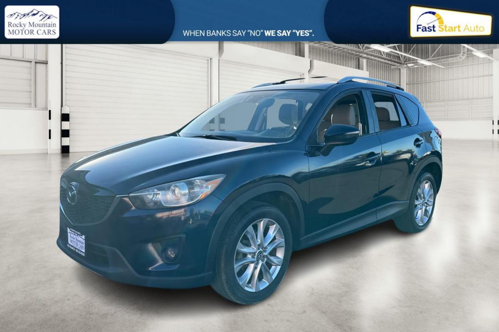 2015 Blue Mazda CX-5 Grand Touring (JM3KE2DY5F0) with an 2.5L L4 DOHC 16V engine, 6-Speed Automatic transmission, located at 344 S Washington Blvd, Ogden, UT, 84404, (801) 399-1799, 41.255482, -111.970848 - Photo#8