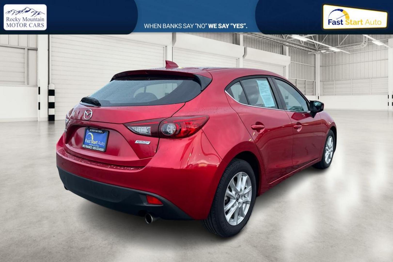 2015 Red Mazda MAZDA3 i Grand Touring AT 5-Door (JM1BM1M75F1) with an 2.0L L4 DOHC 16V engine, 6-Speed Automatic transmission, located at 7755 State Street, Midvale, UT, 84047, (801) 753-9063, 40.610329, -111.890656 - Photo#2