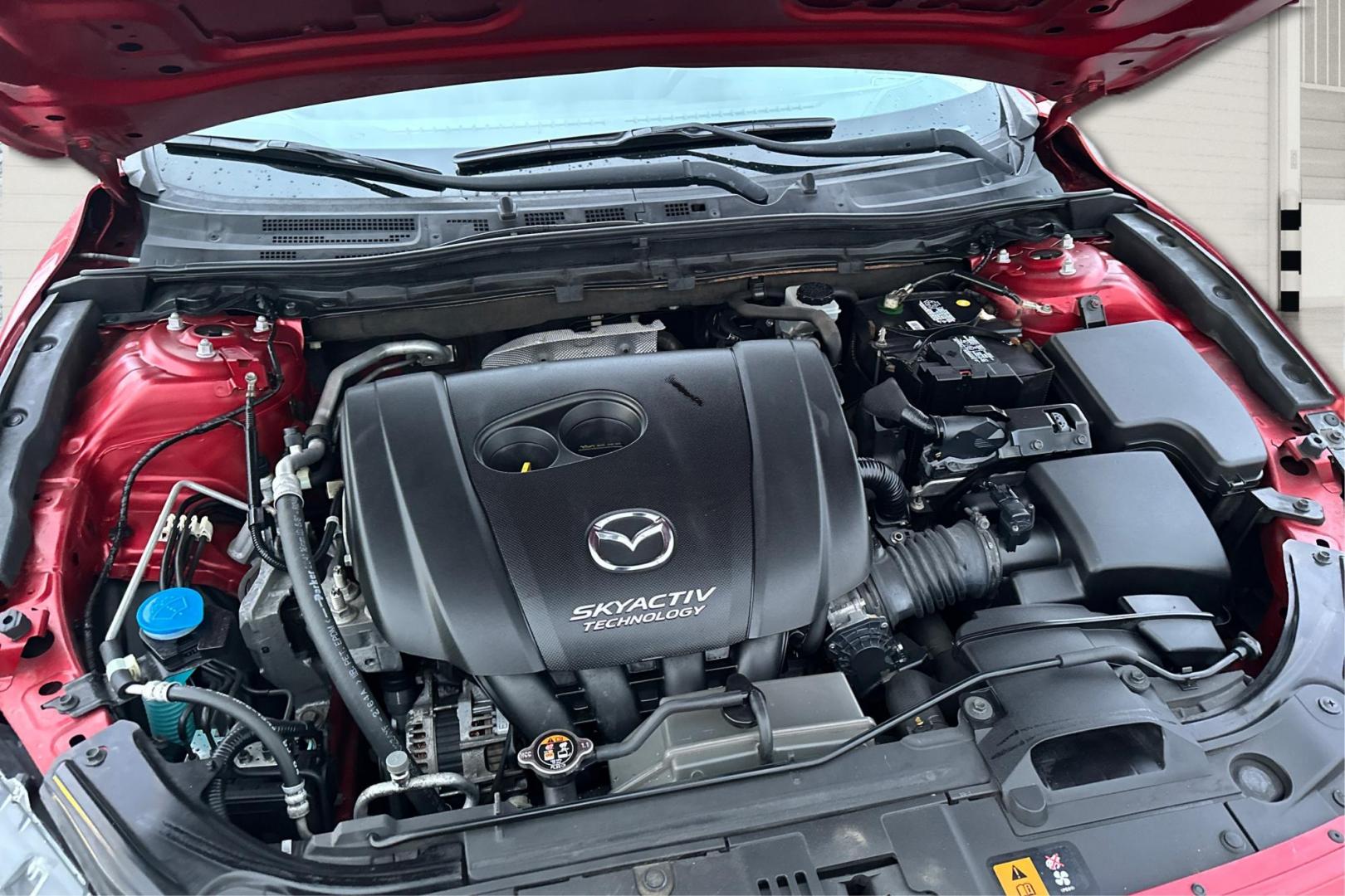 2015 Red Mazda MAZDA3 i Grand Touring AT 5-Door (JM1BM1M75F1) with an 2.0L L4 DOHC 16V engine, 6-Speed Automatic transmission, located at 7755 State Street, Midvale, UT, 84047, (801) 753-9063, 40.610329, -111.890656 - Photo#10