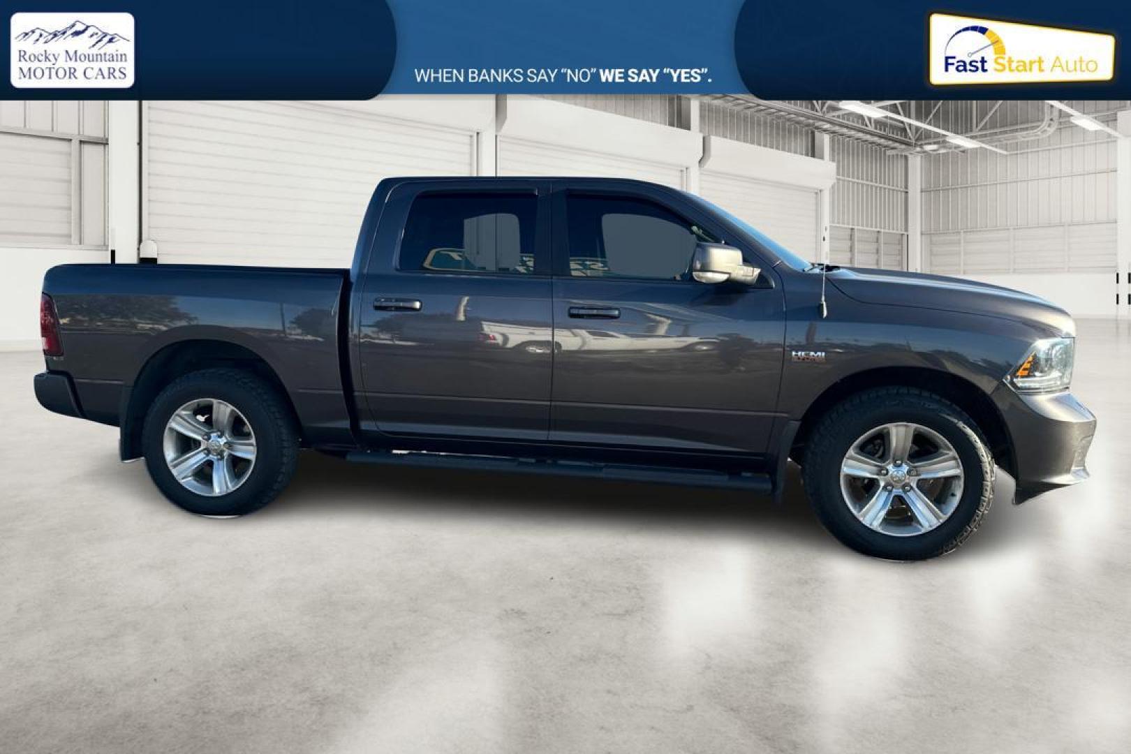 2015 Gray RAM 1500 Sport Crew Cab SWB 4WD (1C6RR7MT1FS) with an 5.7L V8 OHV 16V engine, 6-Speed Automatic transmission, located at 7755 State Street, Midvale, UT, 84047, (801) 753-9063, 40.610329, -111.890656 - Photo#1