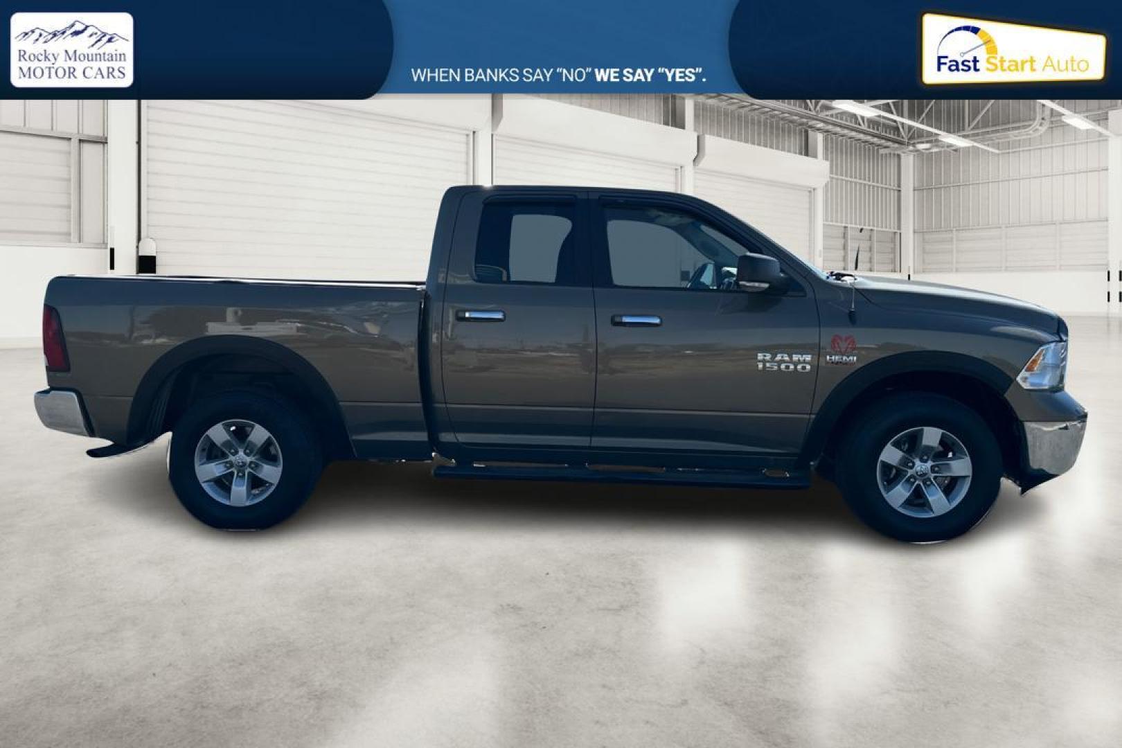 2015 Gold RAM 1500 SLT Quad Cab 4WD (1C6RR7GT8FS) with an 5.7L V8 OHV 16V engine, 6-Speed Automatic transmission, located at 7755 State Street, Midvale, UT, 84047, (801) 753-9063, 40.610329, -111.890656 - Photo#1