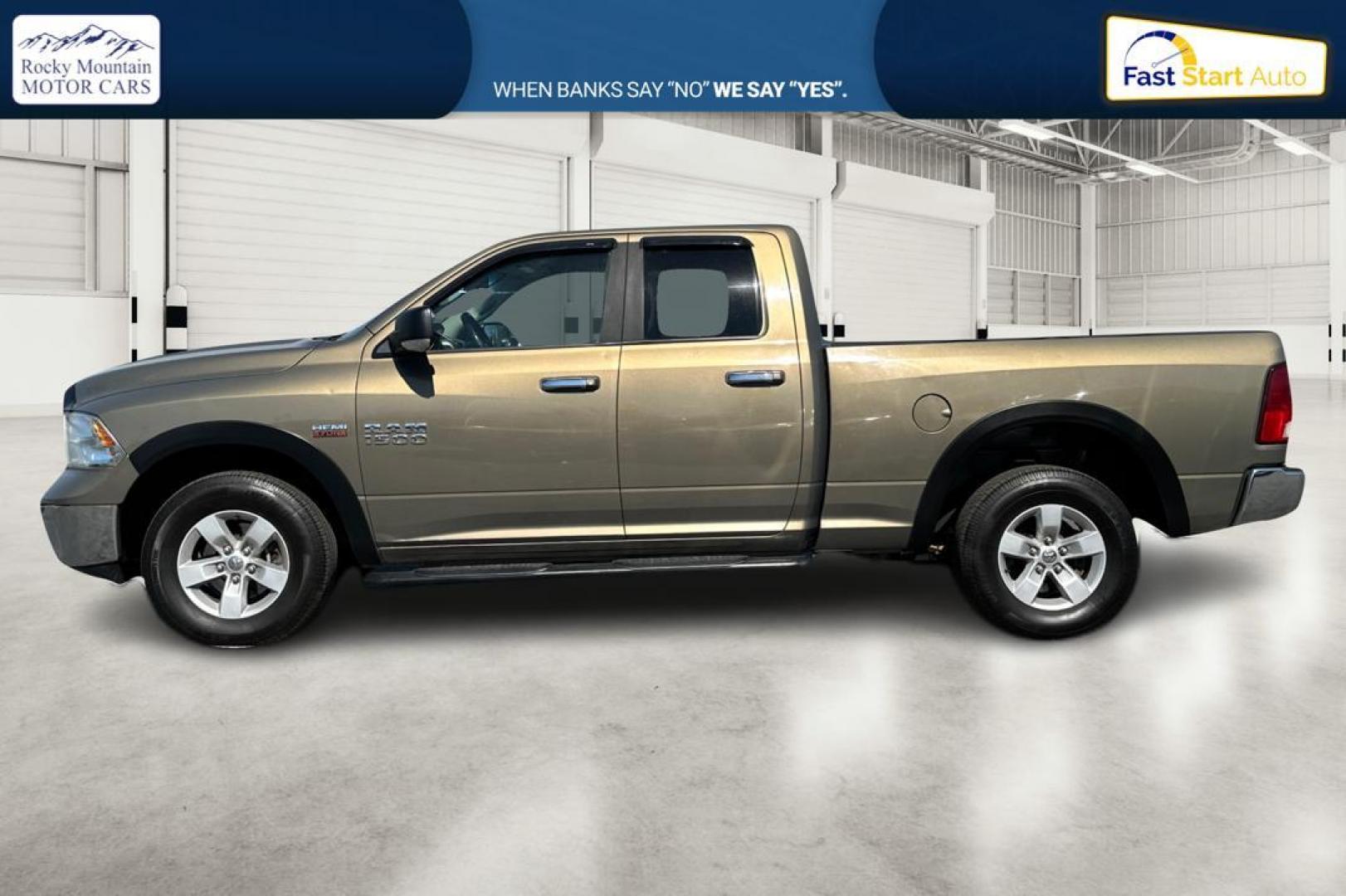 2015 Gold RAM 1500 SLT Quad Cab 4WD (1C6RR7GT8FS) with an 5.7L V8 OHV 16V engine, 6-Speed Automatic transmission, located at 7755 State Street, Midvale, UT, 84047, (801) 753-9063, 40.610329, -111.890656 - Photo#6