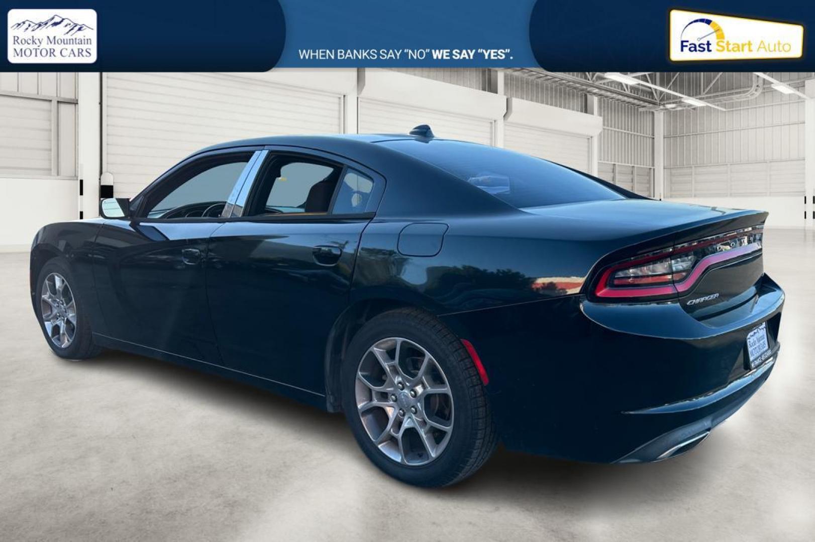 2016 Black Dodge Charger SXT (2C3CDXHG9GH) with an 3.6L V6 DOHC 24V engine, 8A transmission, located at 344 S Washington Blvd, Ogden, UT, 84404, (801) 399-1799, 41.255482, -111.970848 - Photo#5