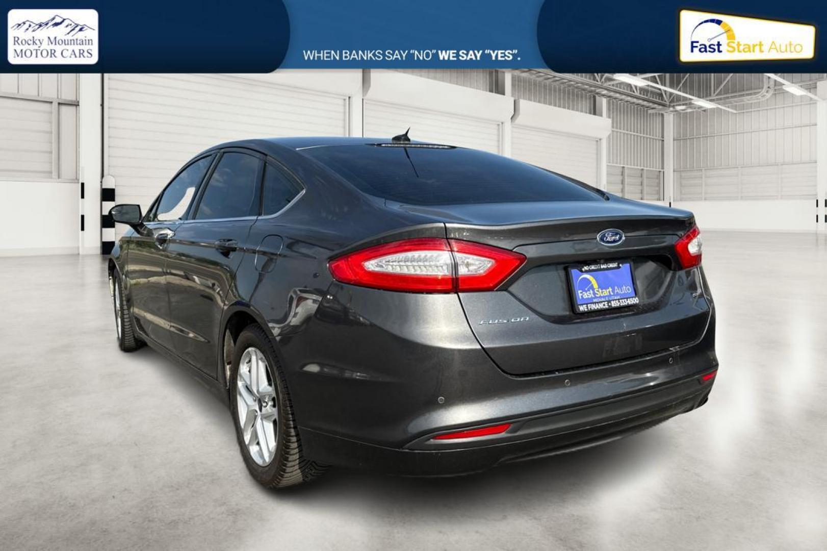 2016 Gray Ford Fusion SE (3FA6P0H7XGR) with an 2.5L L4 DOHC 16V engine, 6-Speed Automatic transmission, located at 7755 State Street, Midvale, UT, 84047, (801) 753-9063, 40.610329, -111.890656 - Photo#4