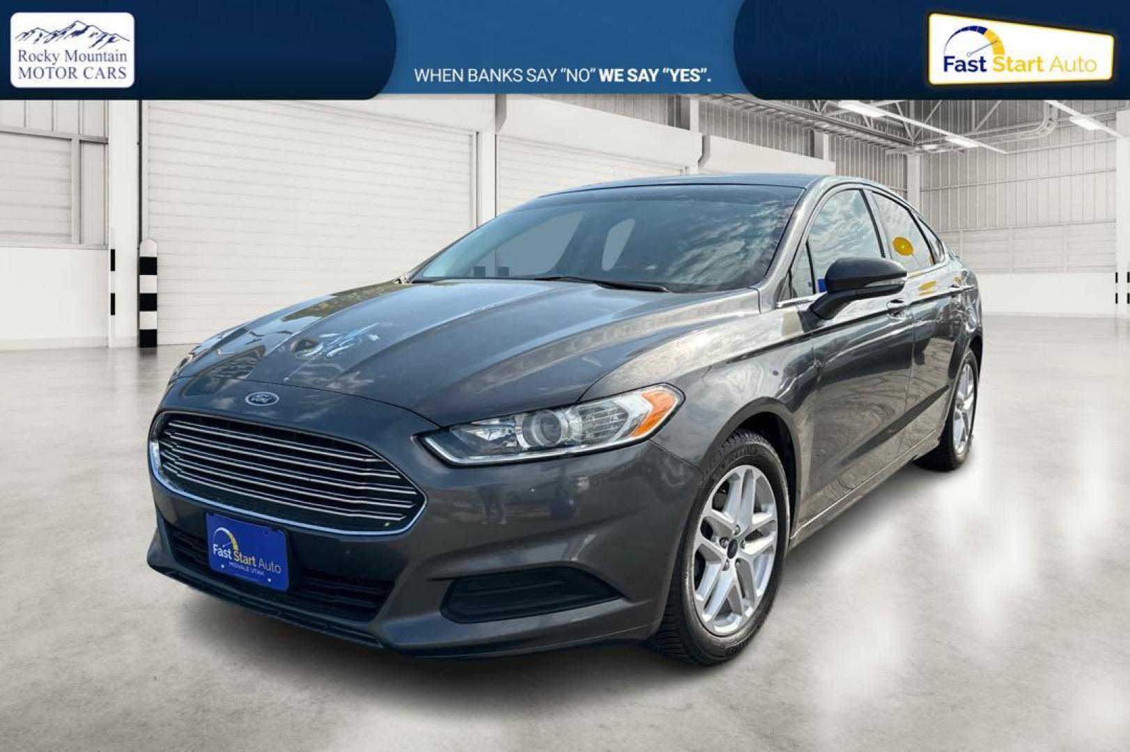 2016 Gray Ford Fusion SE (3FA6P0H7XGR) with an 2.5L L4 DOHC 16V engine, 6-Speed Automatic transmission, located at 7755 State Street, Midvale, UT, 84047, (801) 753-9063, 40.610329, -111.890656 - Photo#6