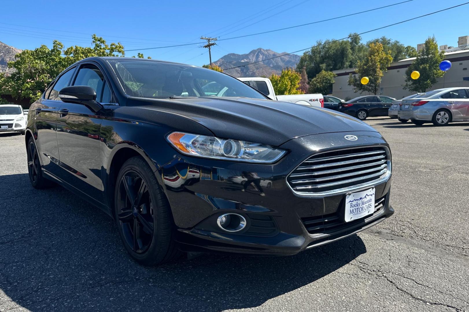 2016 Black Ford Fusion SE (3FA6P0HD8GR) with an 1.5L L4 DOHC 16V engine, 6-Speed Automatic transmission, located at 344 S Washington Blvd, Ogden, UT, 84404, (801) 399-1799, 41.255482, -111.970848 - Photo#0