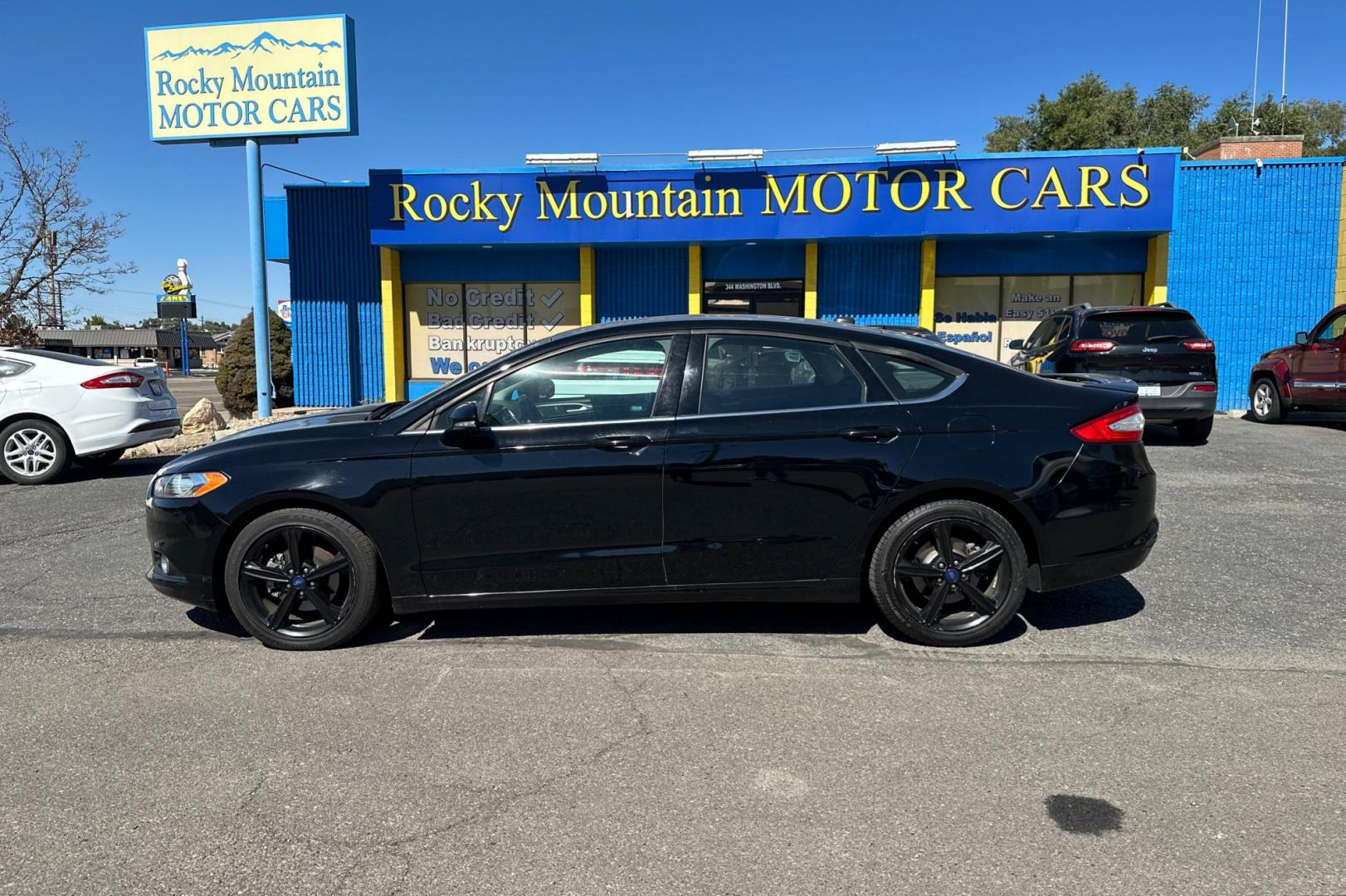 2016 Black Ford Fusion SE (3FA6P0HD8GR) with an 1.5L L4 DOHC 16V engine, 6-Speed Automatic transmission, located at 344 S Washington Blvd, Ogden, UT, 84404, (801) 399-1799, 41.255482, -111.970848 - Photo#5