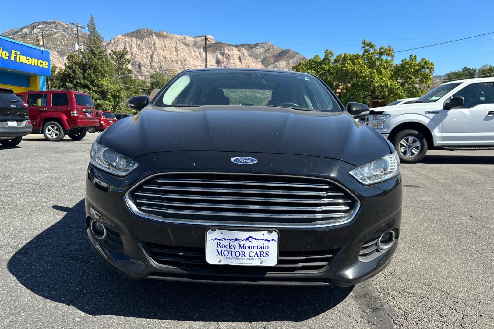 2016 Black Ford Fusion SE (3FA6P0HD8GR) with an 1.5L L4 DOHC 16V engine, 6-Speed Automatic transmission, located at 344 S Washington Blvd, Ogden, UT, 84404, (801) 399-1799, 41.255482, -111.970848 - Photo#7