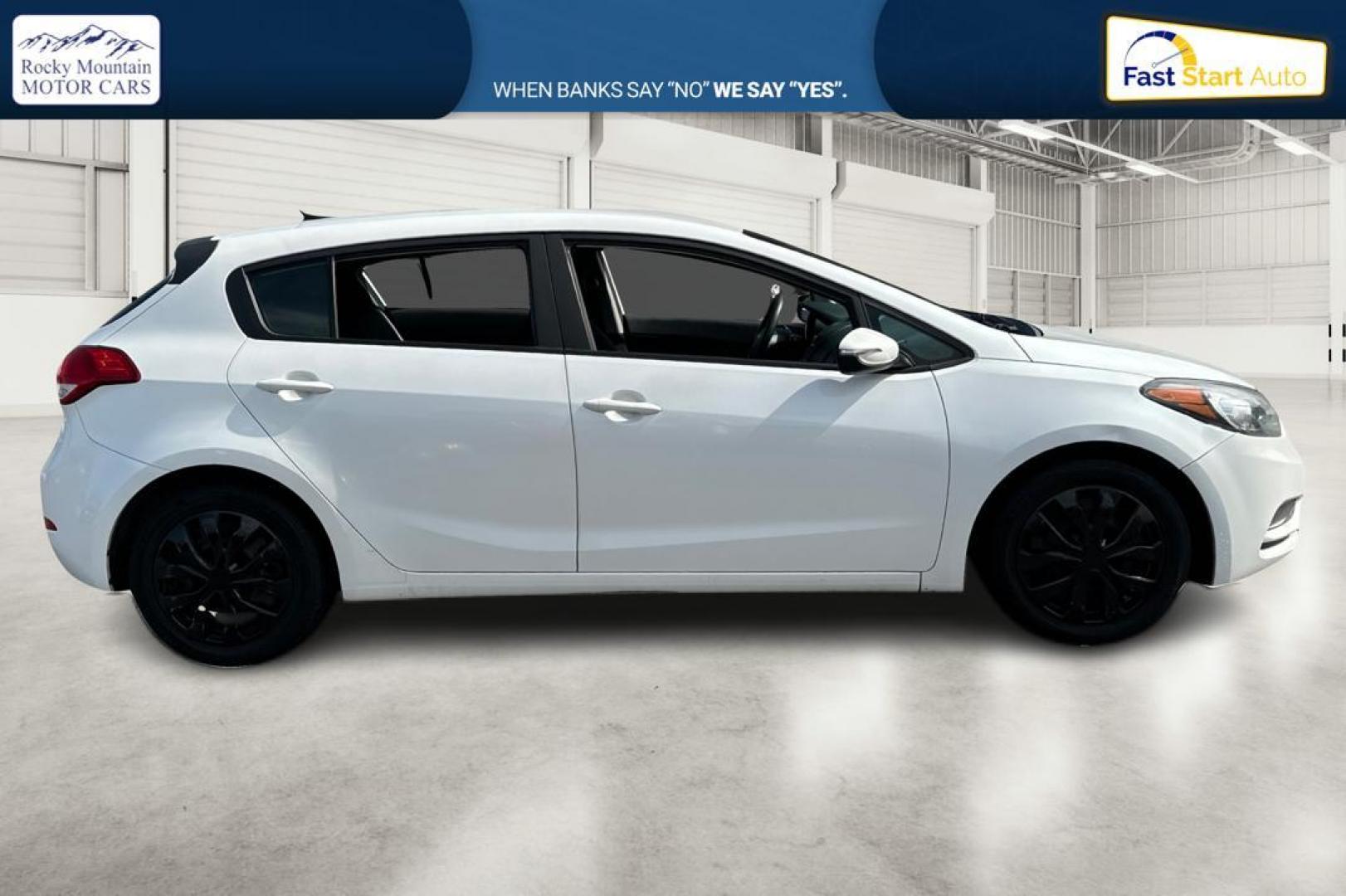 2016 White Kia Forte 5-Door LX (KNAFK5A84G5) with an 2.0L L4 DOHC 16V engine, 6-Speed Automatic transmission, located at 344 S Washington Blvd, Ogden, UT, 84404, (801) 399-1799, 41.255482, -111.970848 - Photo#1