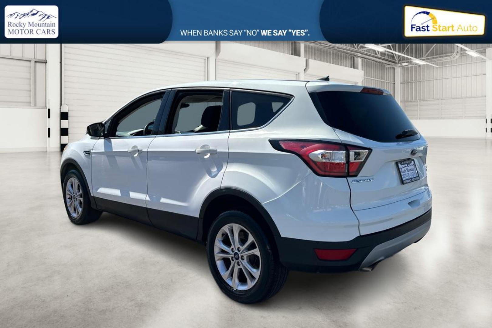 2017 White Ford Escape SE FWD (1FMCU0GDXHU) with an 1.5L L4 DOHC 16V engine, 6A transmission, located at 767 S State Road, Pleasant Grove, UT, 84062, (801) 785-1058, 40.354839, -111.736687 - Photo#4