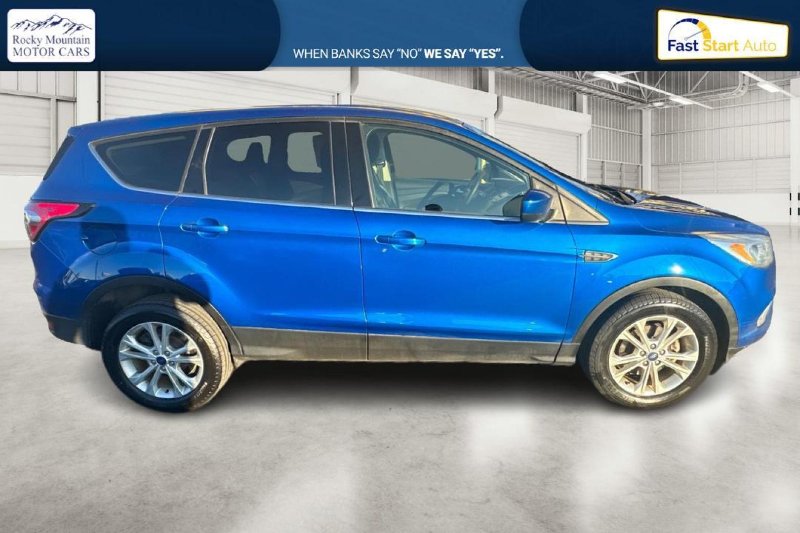 2017 Blue Ford Escape SE FWD (1FMCU0GD9HU) with an 1.5L L4 DOHC 16V engine, 6A transmission, located at 7755 State Street, Midvale, UT, 84047, (801) 753-9063, 40.610329, -111.890656 - Photo#1