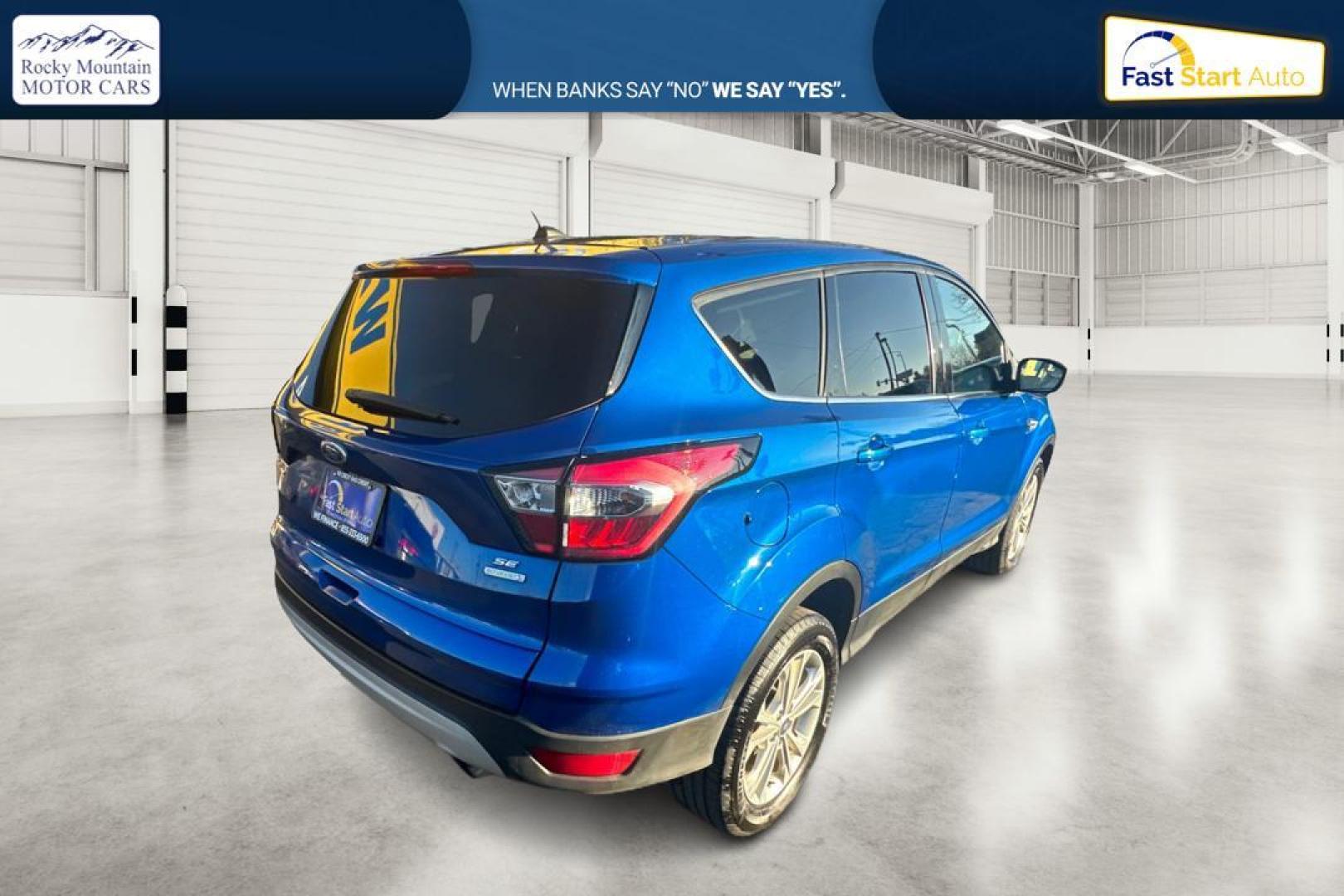 2017 Blue Ford Escape SE FWD (1FMCU0GD9HU) with an 1.5L L4 DOHC 16V engine, 6A transmission, located at 7755 State Street, Midvale, UT, 84047, (801) 753-9063, 40.610329, -111.890656 - Photo#2
