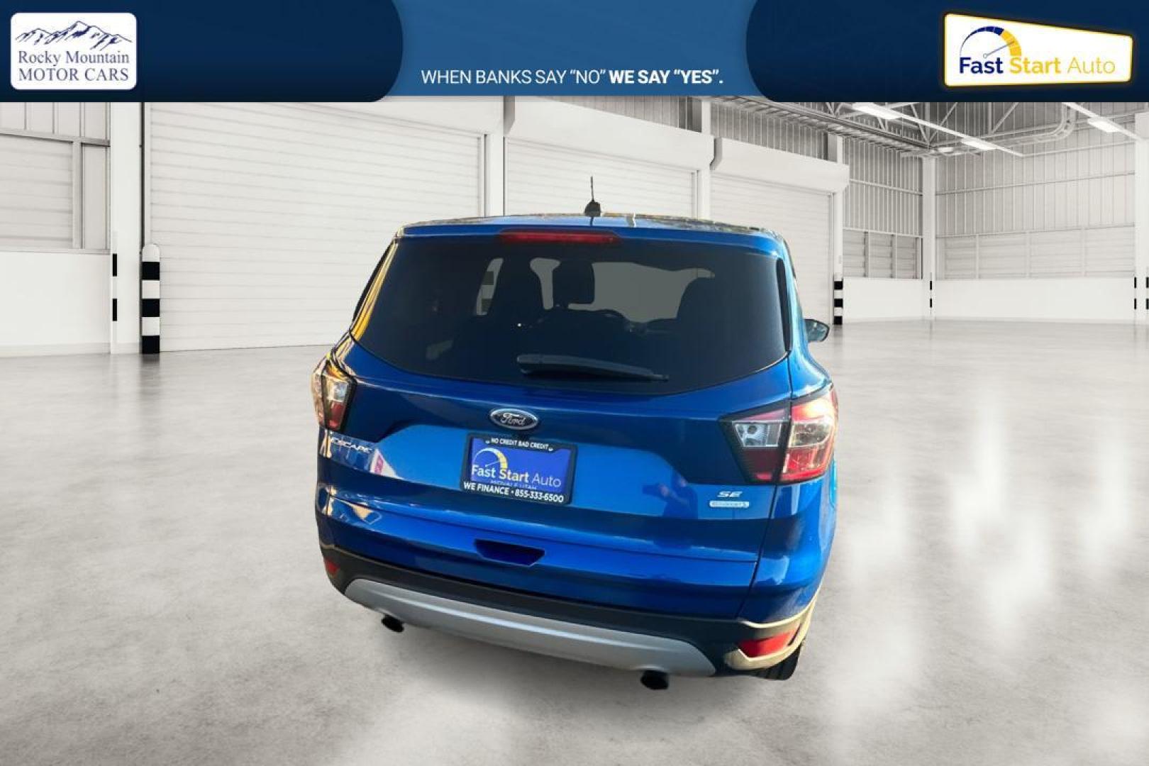 2017 Blue Ford Escape SE FWD (1FMCU0GD9HU) with an 1.5L L4 DOHC 16V engine, 6A transmission, located at 7755 State Street, Midvale, UT, 84047, (801) 753-9063, 40.610329, -111.890656 - Photo#3