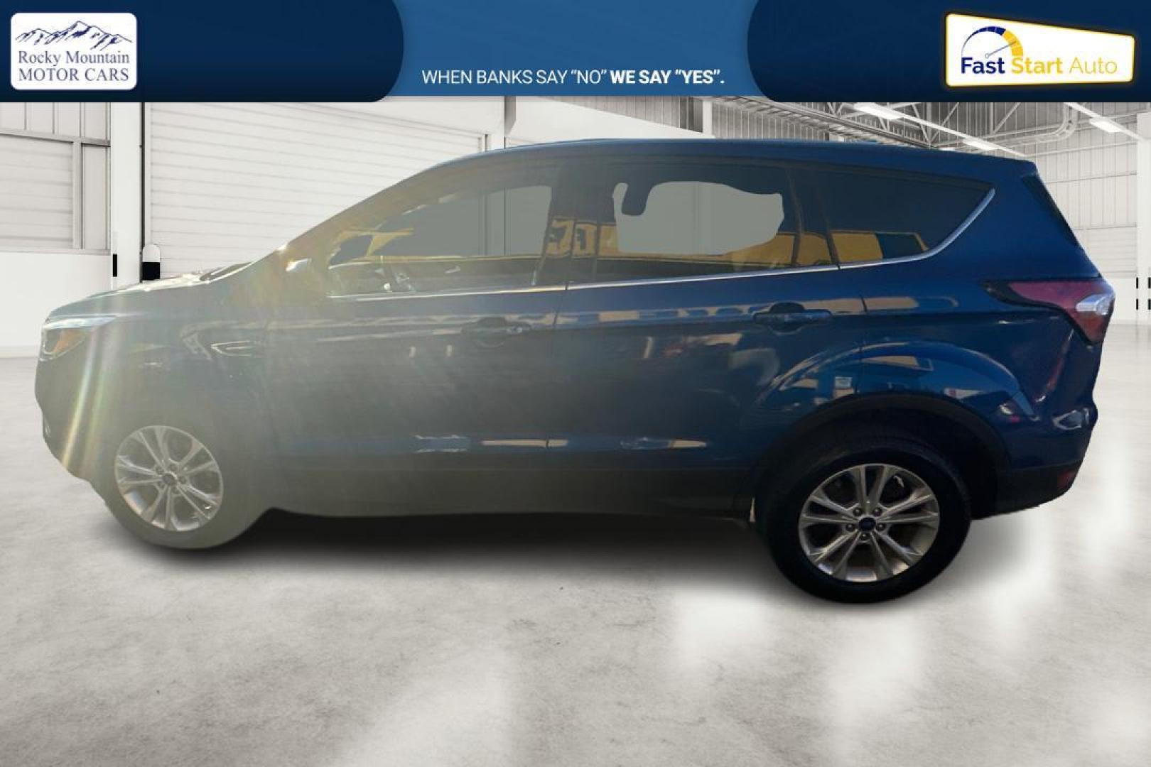 2017 Blue Ford Escape SE FWD (1FMCU0GD9HU) with an 1.5L L4 DOHC 16V engine, 6A transmission, located at 7755 State Street, Midvale, UT, 84047, (801) 753-9063, 40.610329, -111.890656 - Photo#5