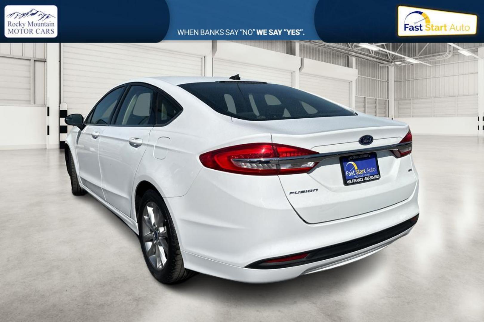 2017 White Ford Fusion SE (3FA6P0H74HR) with an 2.5L L4 DOHC 16V engine, 6A transmission, located at 344 S Washington Blvd, Ogden, UT, 84404, (801) 399-1799, 41.255482, -111.970848 - Photo#4