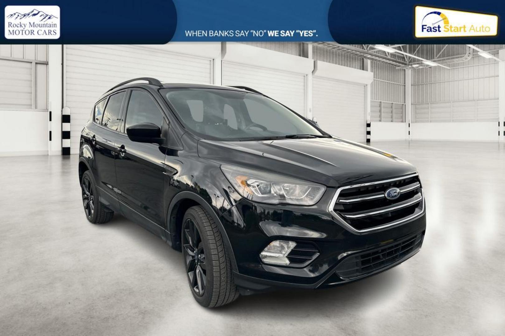 2018 Black Ford Escape SE FWD (1FMCU0GD9JU) with an 1.5L L4 DOHC 16V engine, 6A transmission, located at 7755 State Street, Midvale, UT, 84047, (801) 753-9063, 40.610329, -111.890656 - Photo#0