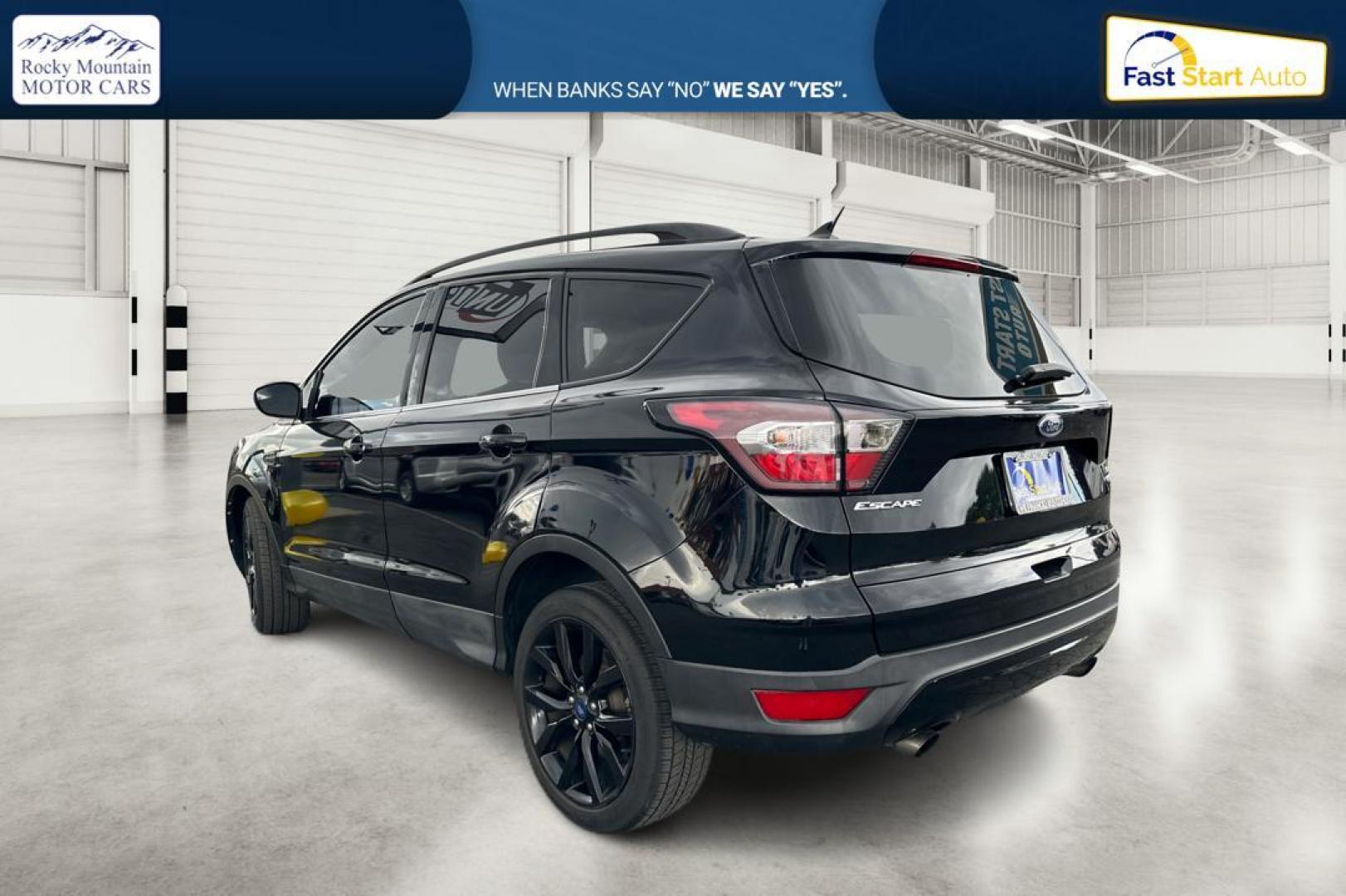 2018 Black Ford Escape SE FWD (1FMCU0GD9JU) with an 1.5L L4 DOHC 16V engine, 6A transmission, located at 7755 State Street, Midvale, UT, 84047, (801) 753-9063, 40.610329, -111.890656 - Photo#4