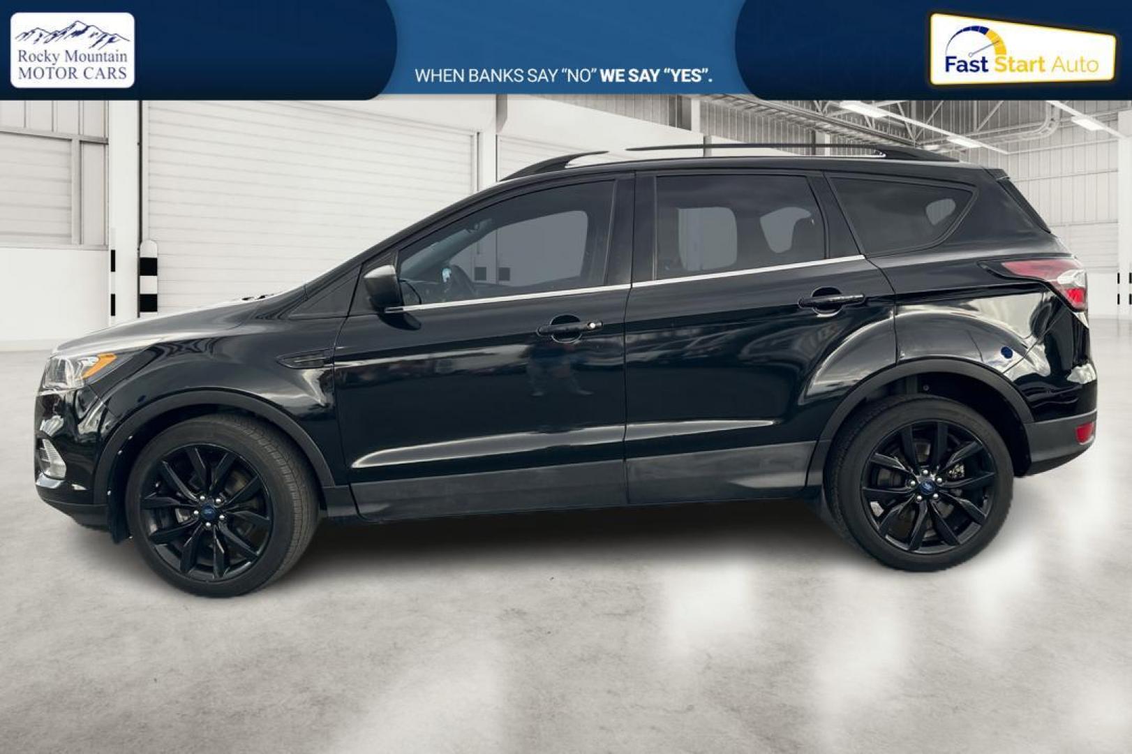 2018 Black Ford Escape SE FWD (1FMCU0GD9JU) with an 1.5L L4 DOHC 16V engine, 6A transmission, located at 7755 State Street, Midvale, UT, 84047, (801) 753-9063, 40.610329, -111.890656 - Photo#5