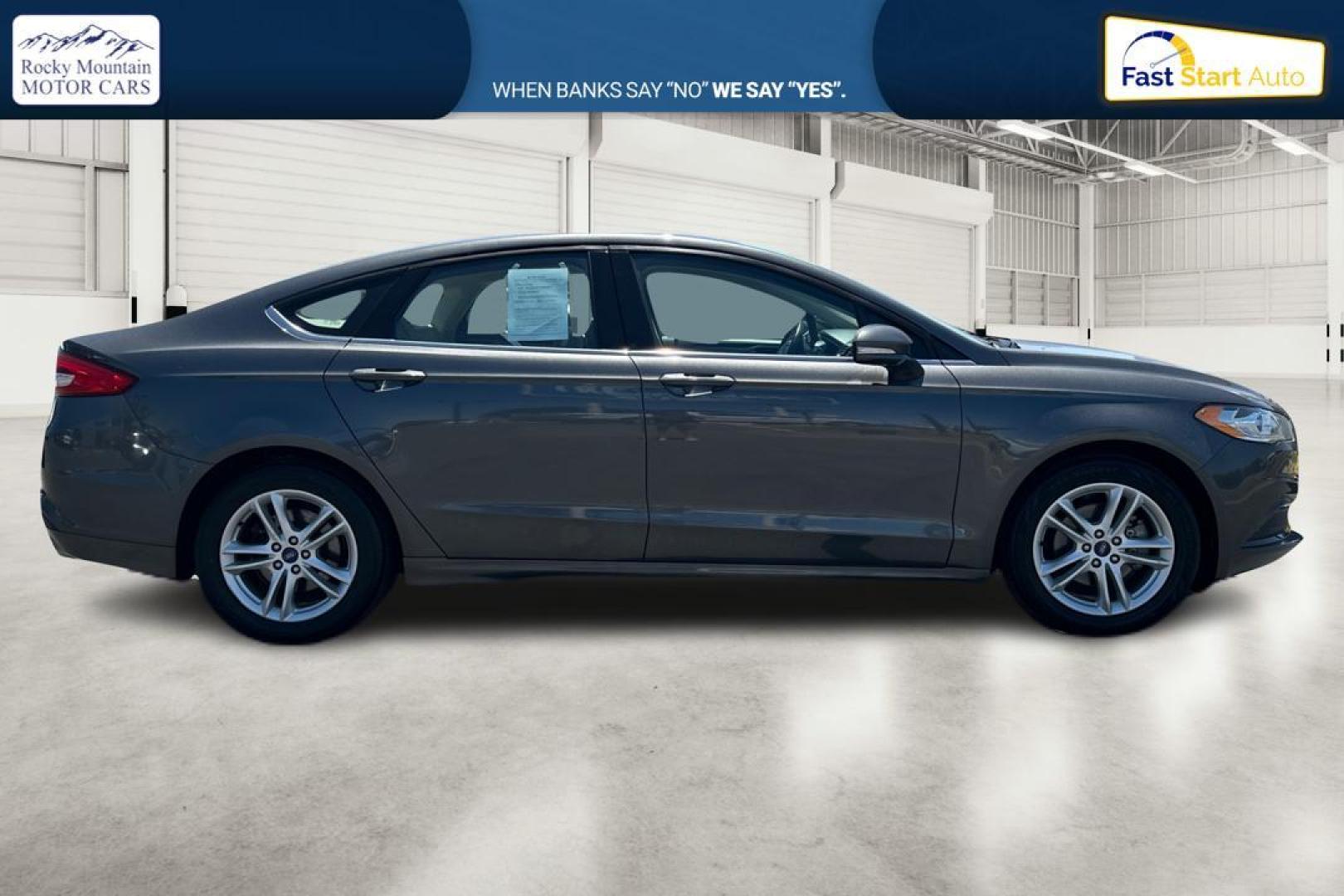 2018 Gray Ford Fusion SE (3FA6P0HD7JR) with an 1.5L L4 DOHC 16V engine, 6A transmission, located at 7755 State Street, Midvale, UT, 84047, (801) 753-9063, 40.610329, -111.890656 - Photo#1