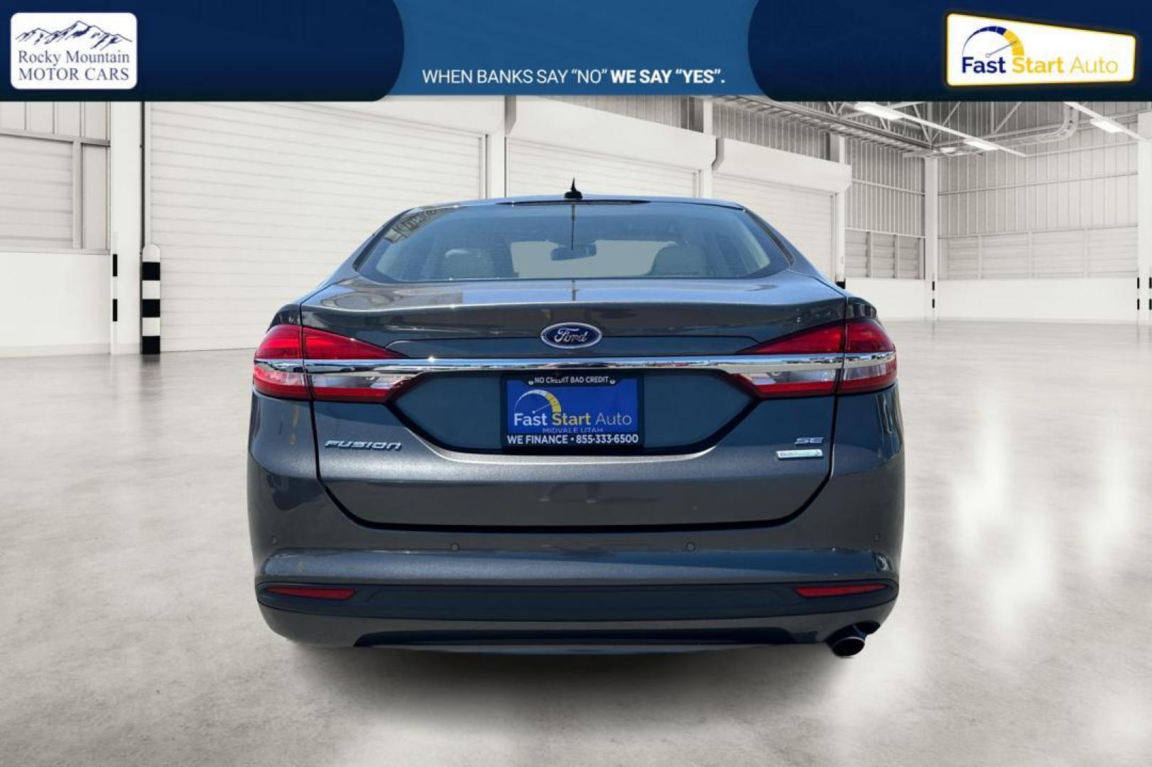 2018 Gray Ford Fusion SE (3FA6P0HD7JR) with an 1.5L L4 DOHC 16V engine, 6A transmission, located at 7755 State Street, Midvale, UT, 84047, (801) 753-9063, 40.610329, -111.890656 - Photo#3