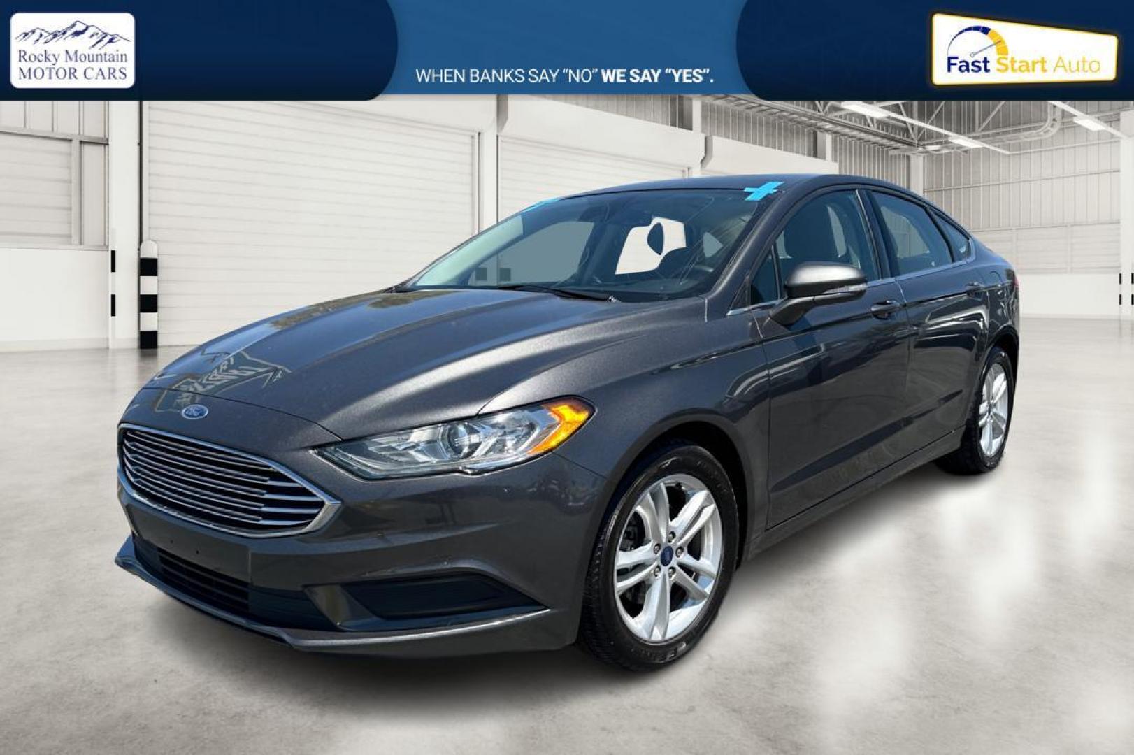 2018 Gray Ford Fusion SE (3FA6P0HD7JR) with an 1.5L L4 DOHC 16V engine, 6A transmission, located at 7755 State Street, Midvale, UT, 84047, (801) 753-9063, 40.610329, -111.890656 - Photo#6